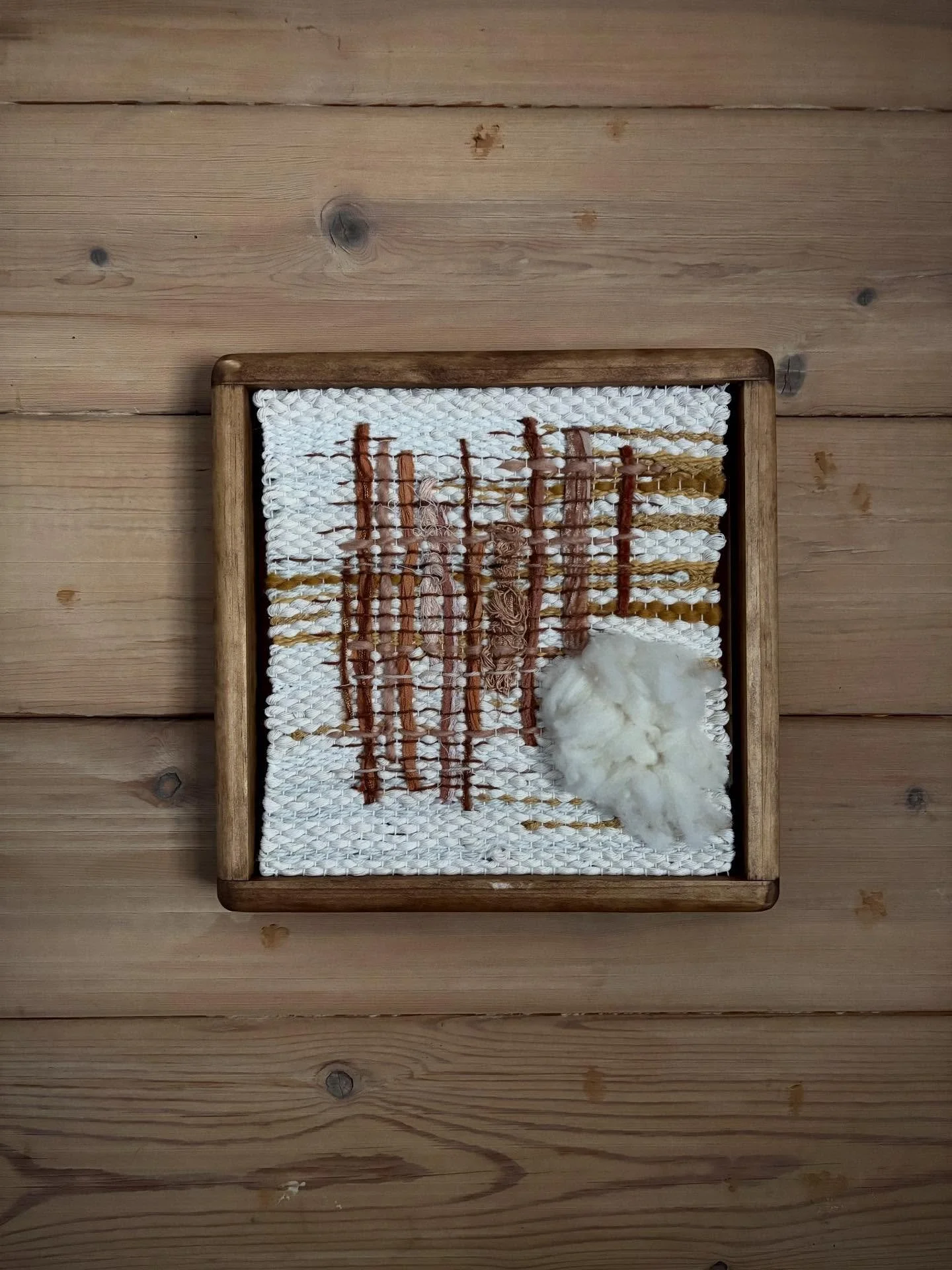 if you miss the details on this one, you miss the whole thing. the colors remind me of a desert sunset.

handwoven fiber art with wool, cotton, &amp; silk. 
12x12 wood frame. 

#3pinesmercantile #wovenart #fiberart #weaving