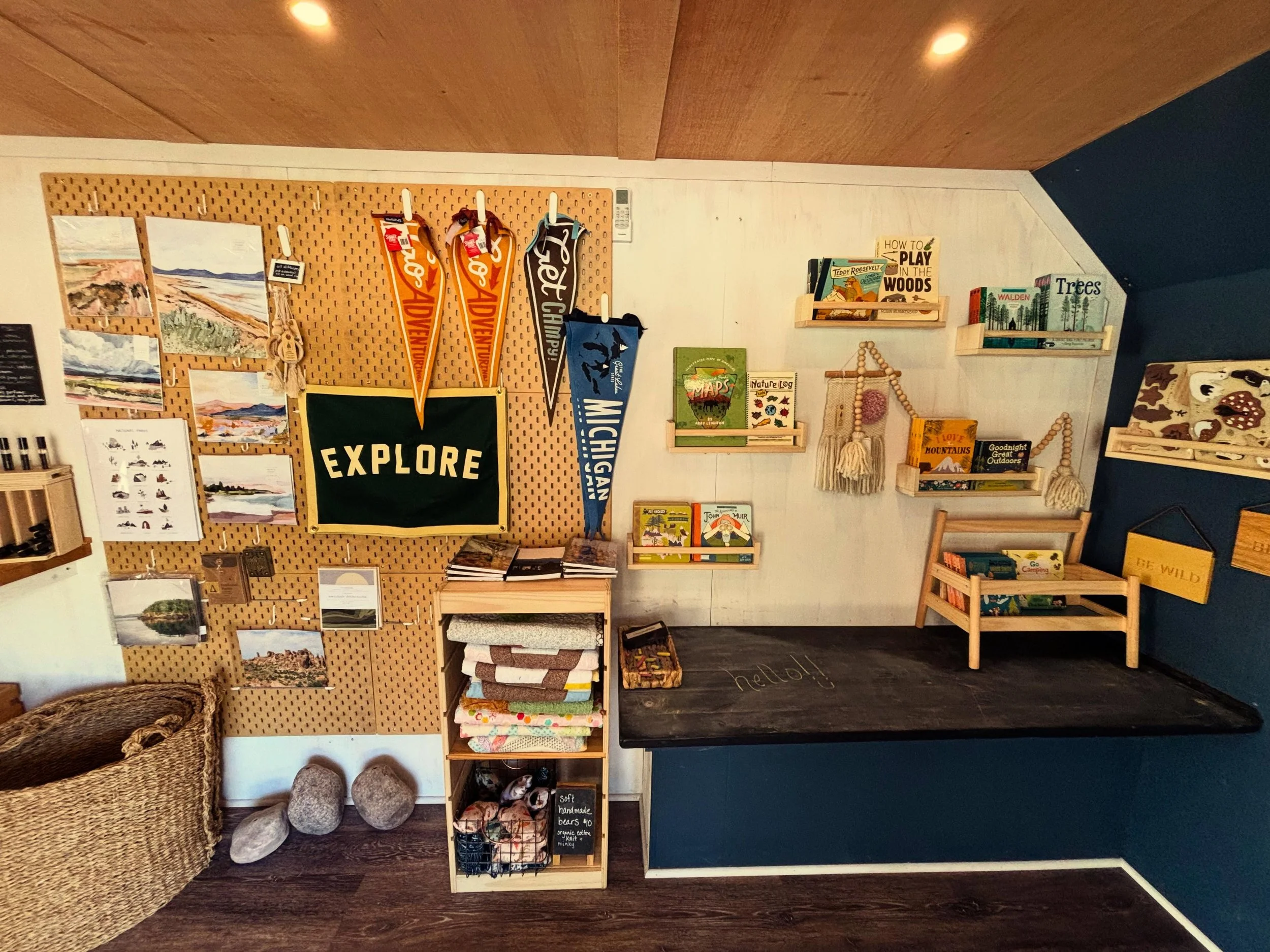 I love this little corner of our mobile shop. curated nature, camping, &amp; National Park kid&rsquo;s books; wooden puzzles; pretty adventure decor. &amp; a chalkboard counter for shoppers to leave cutie drawings &amp; encouraging notes. after a mar