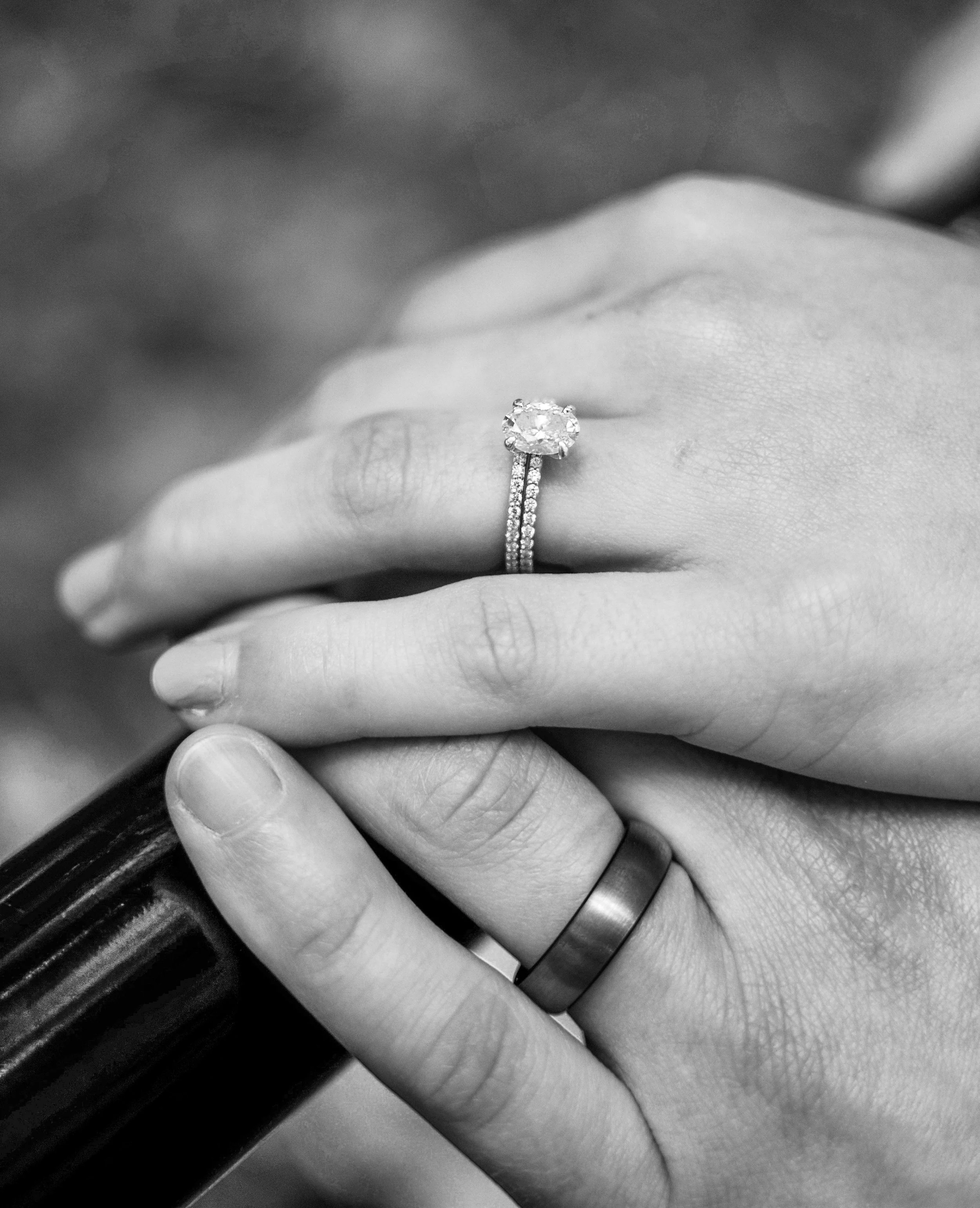 Close-up of a couple's hands with wedding rings