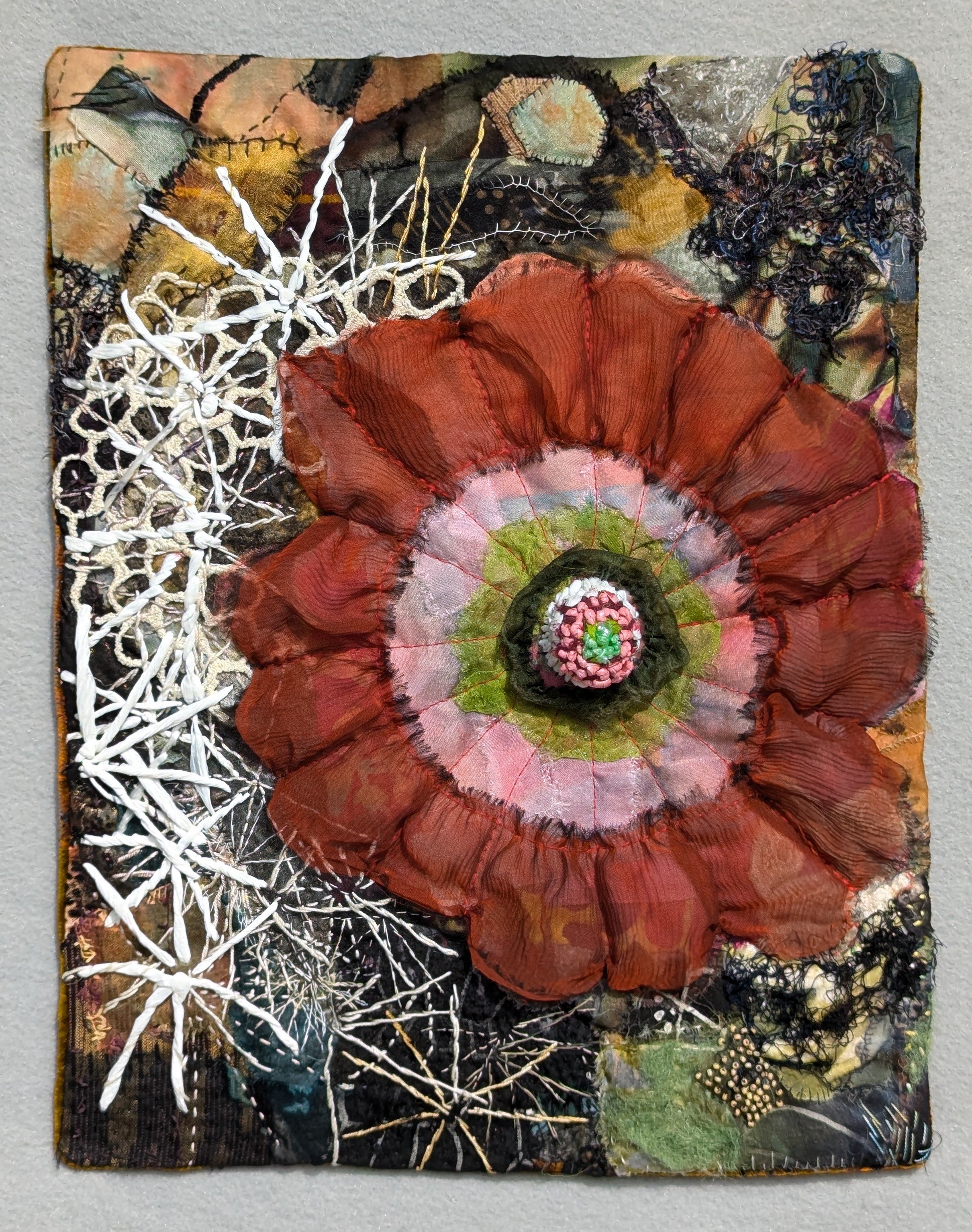 Nancy Nakamoto, Blooming Hedgehog, quilted scraps of fiber and plastic, thread, beads, 14x11"
