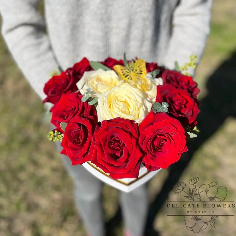 Heart-shaped arrangement with red and ivory roses, accented with eucalyptus and a decorative butterfly — handcrafted same-day by Delicate Flowers by Andreea in Wesley Chapel, Florida