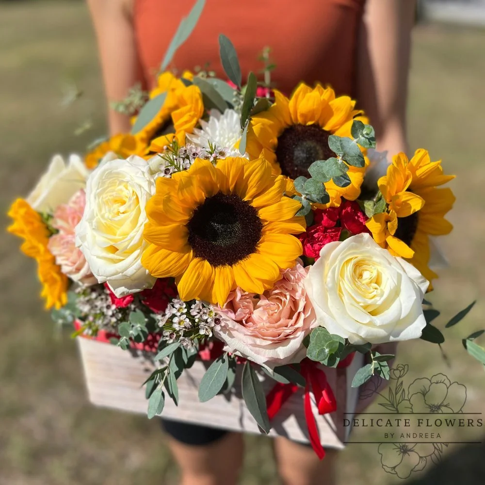 Fall Beauty flower arrangement with sunflowers, ivory roses, blush blooms, eucalyptus, and seasonal accents