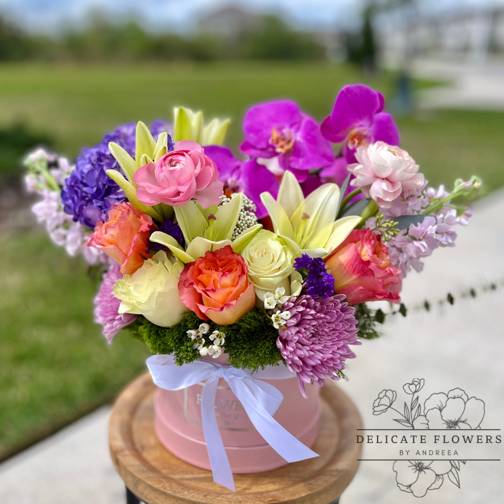 Tropical Paradise Charm features a vibrant mix of tropical blooms and lush greenery, designed to evoke the warmth, color, and carefree beauty of an island escape. Handcrafted flower delivery in Wesley Chapel, FL