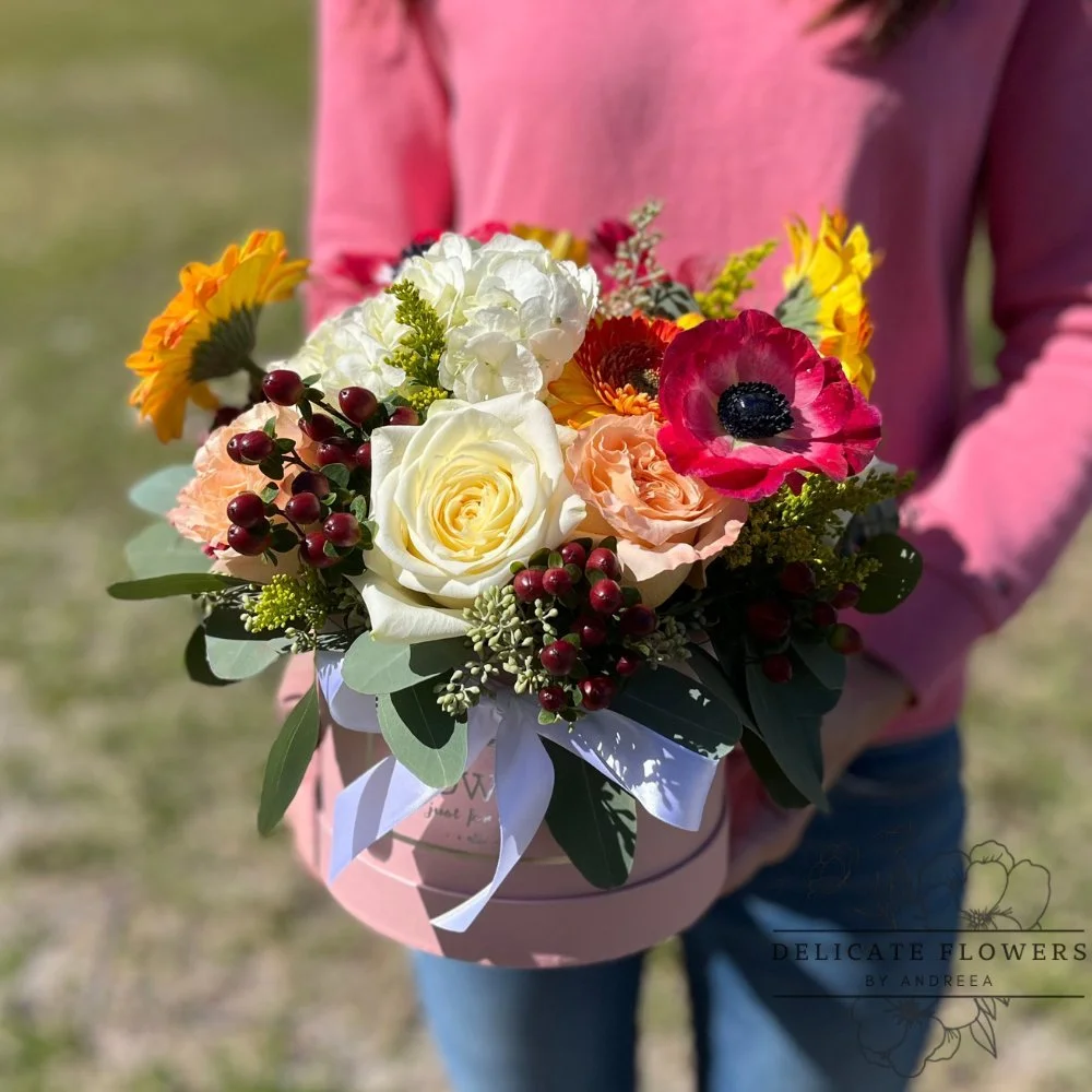 Colorful hat box arrangement with white roses, hydrangea, anemone, gerberas, berries, and seasonal blooms — handcrafted same-day by Delicate Flowers by Andreea in Wesley Chapel, Florida