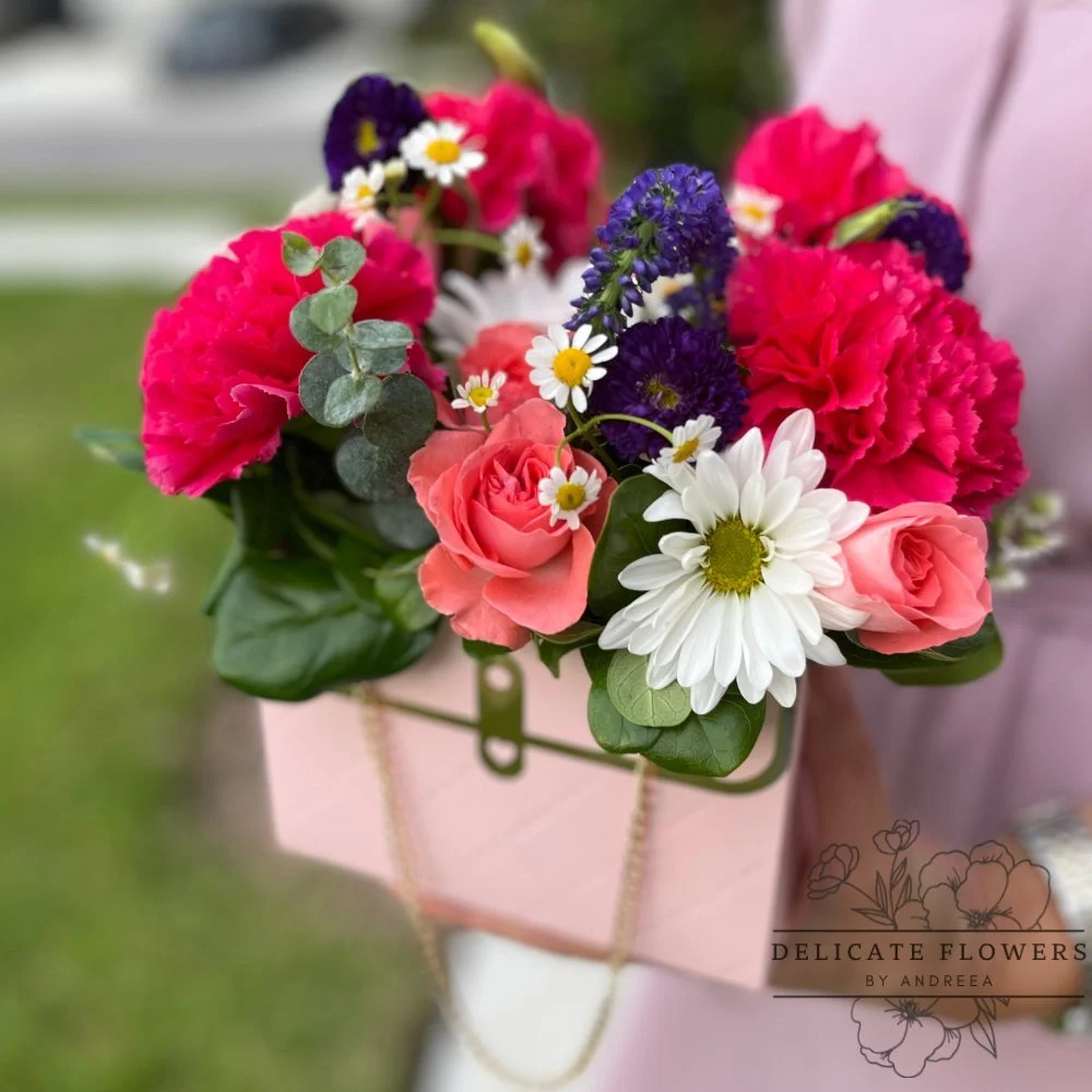 Chic Purse flower arrangement with premium blooms in a purse-shaped container