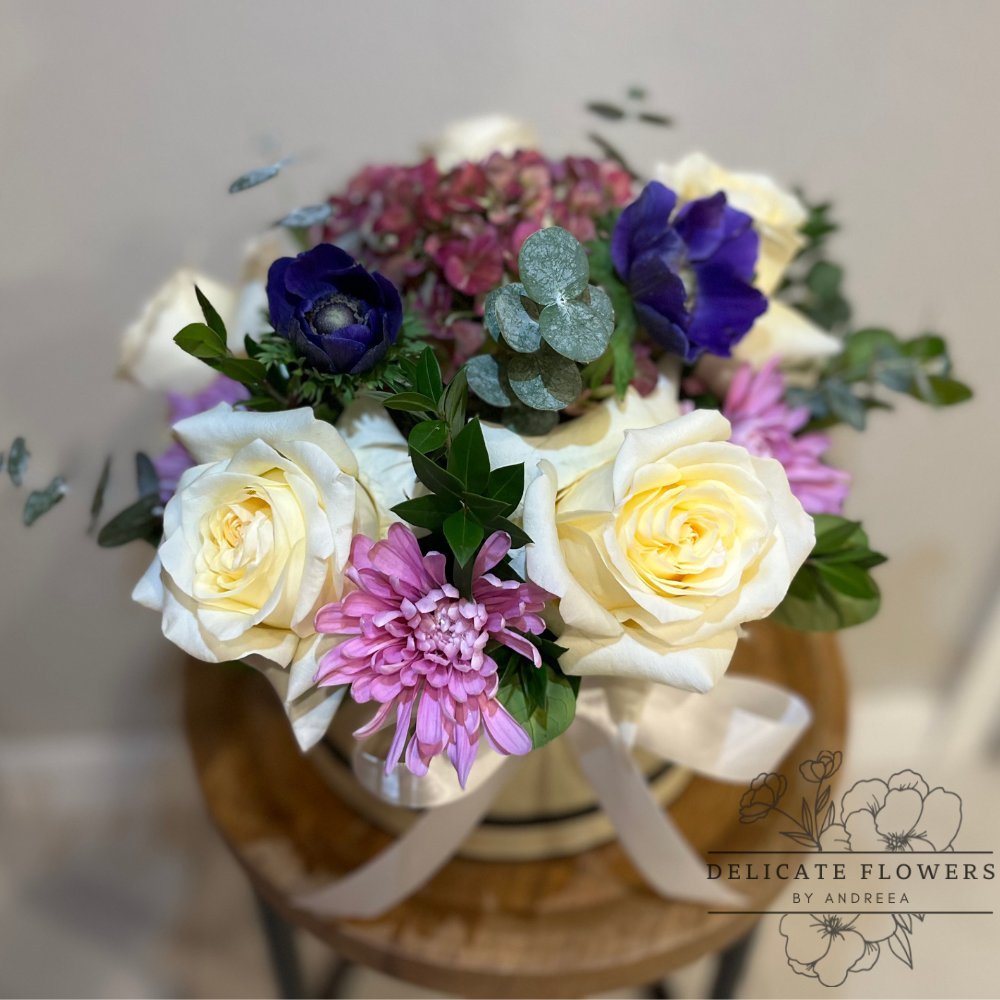 Twilight Mosaic floral arrangement with cream roses, blue and purple blooms in a decorative box, handcrafted by Delicate Flowers by Andreea in Wesley Chapel Florida