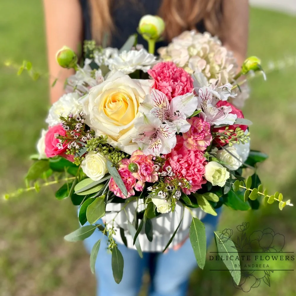 Radiant Charm hatbox flower arrangement with yellow roses, pink carnations, alstroemeria, hydrangea, and greenery — handcrafted same-day by Delicate Flowers by Andreea in Wesley Chapel, Florida