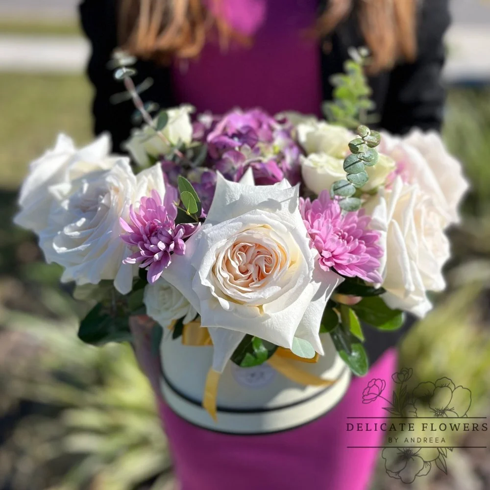 Purple Majesty flower arrangement with ivory and blush roses, purple hydrangea, lavender chrysanthemums, and eucalyptus