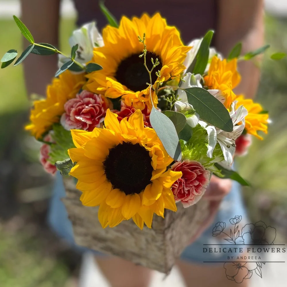 Golden Glow flower arrangement with sunflowers, seasonal blooms, fresh greenery, and natural textures
