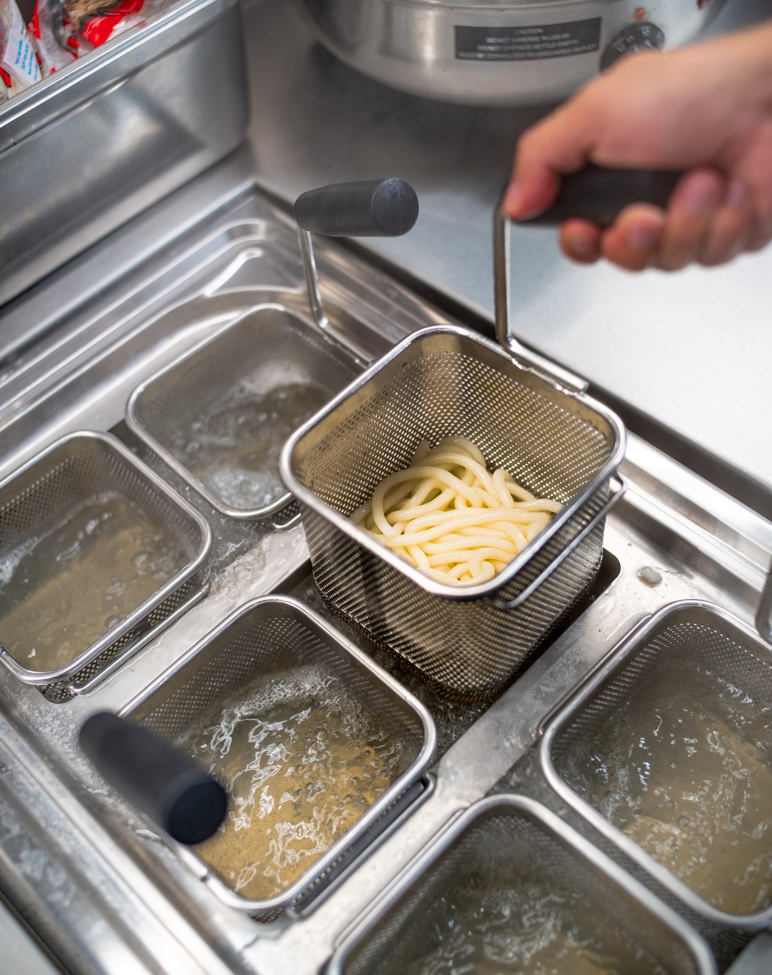 Cook udon noodles