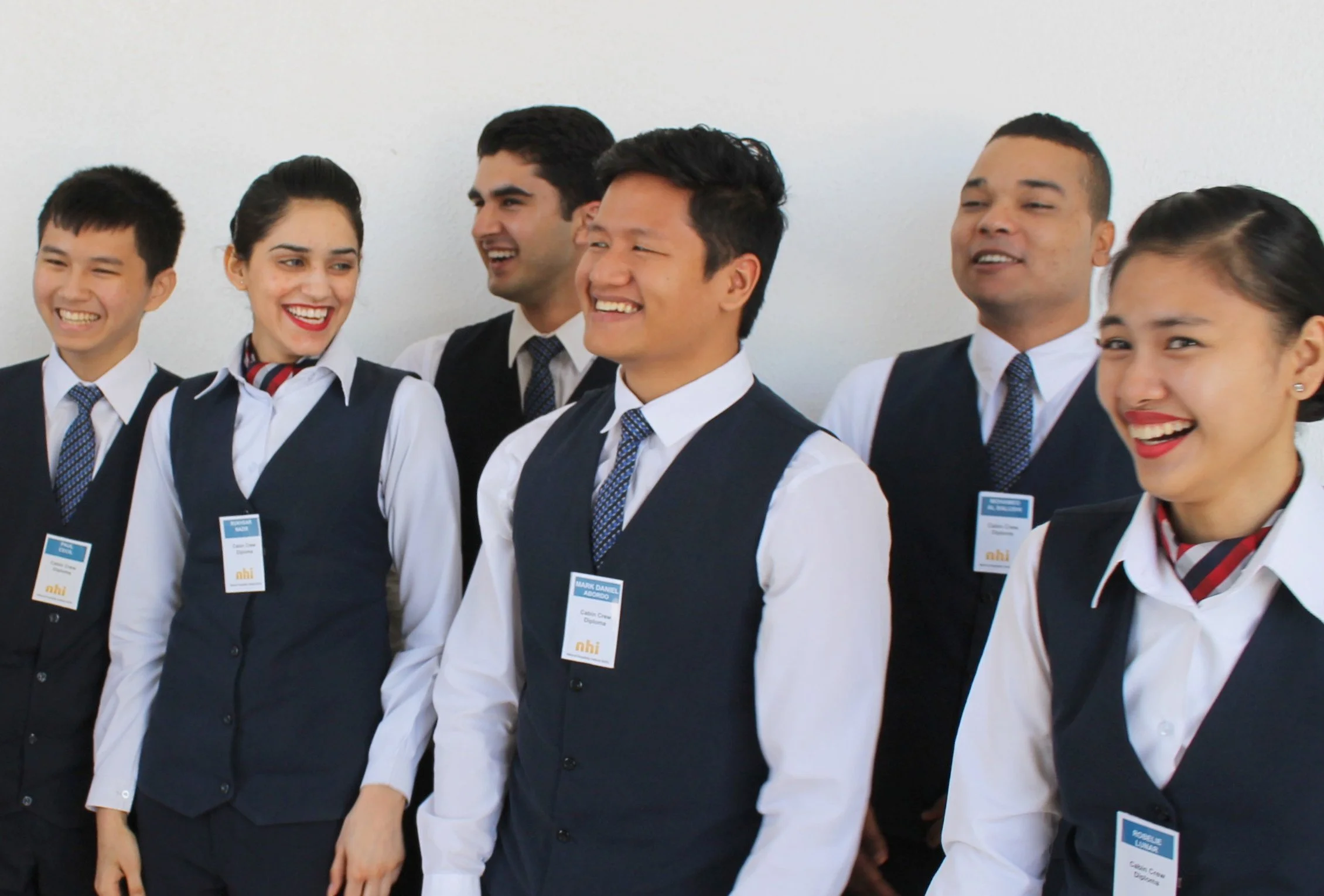 two NHI cabin crew students sitting in a classroom