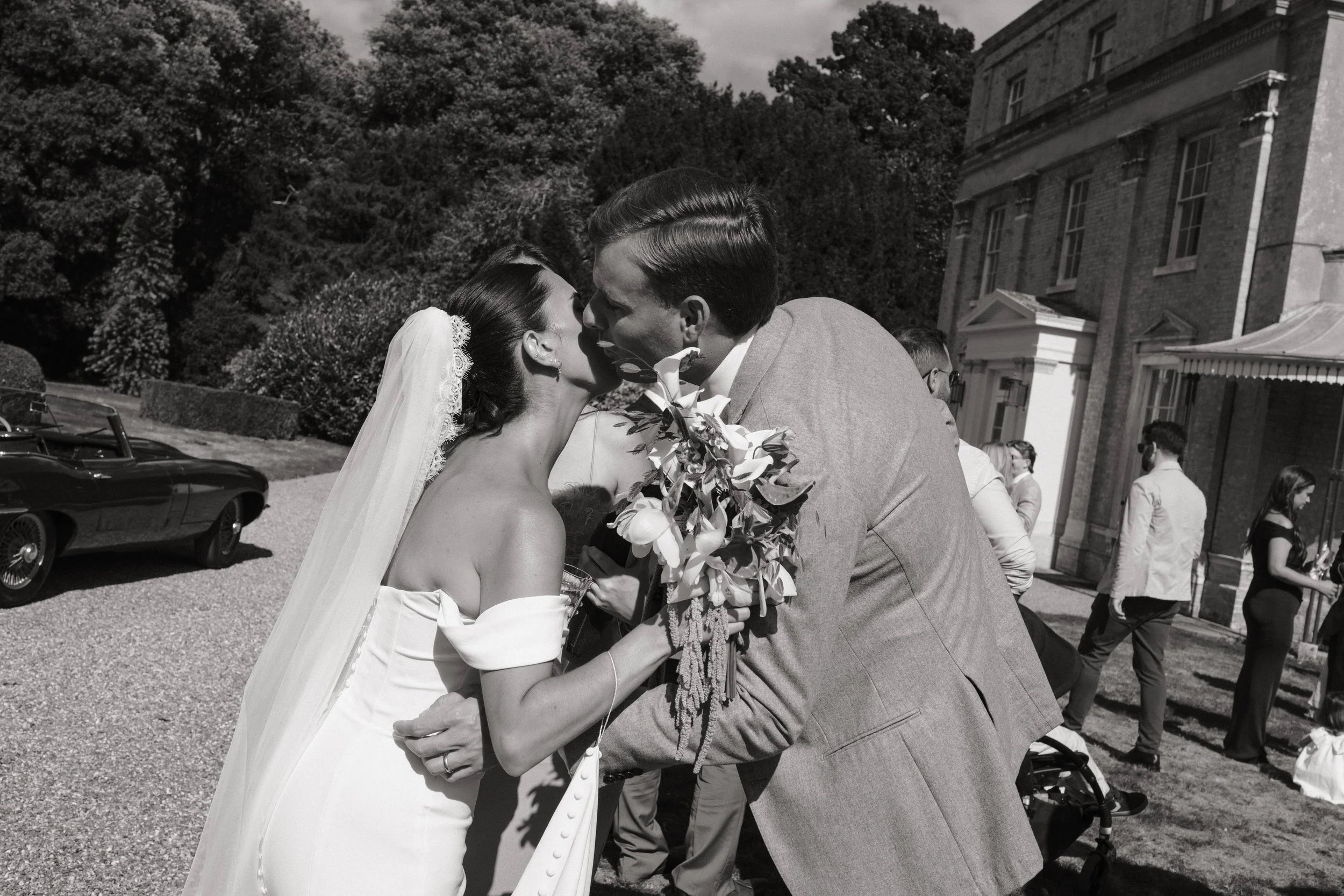 black-and-white-bride-groom-wedding-kiss.jpeg