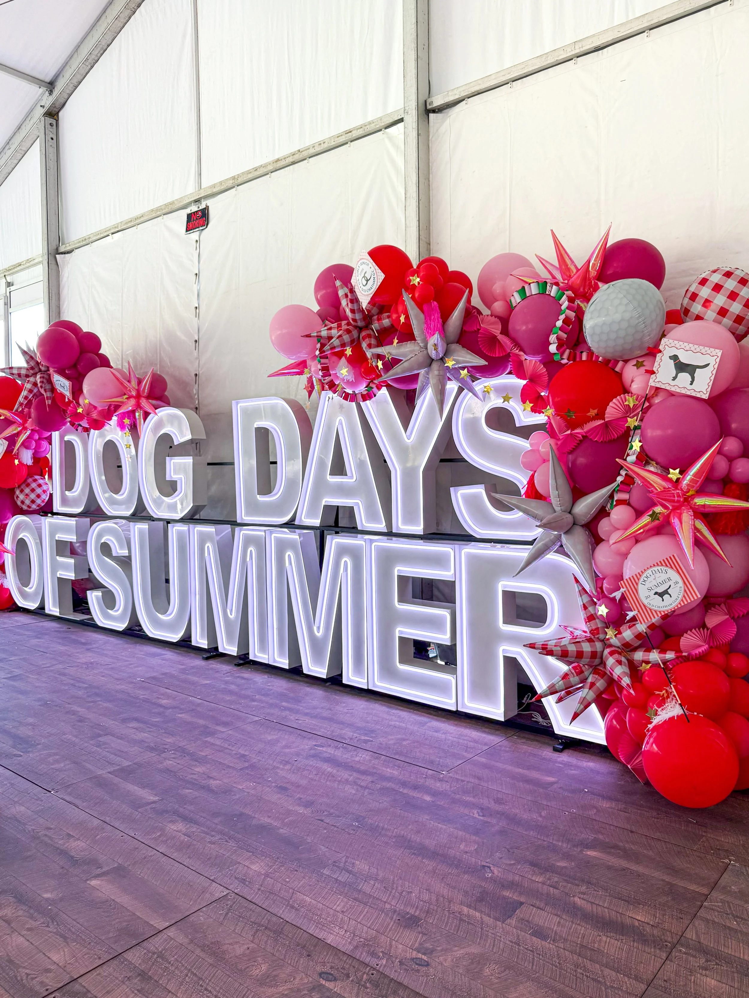 marquees dog days of summer with pink balloons