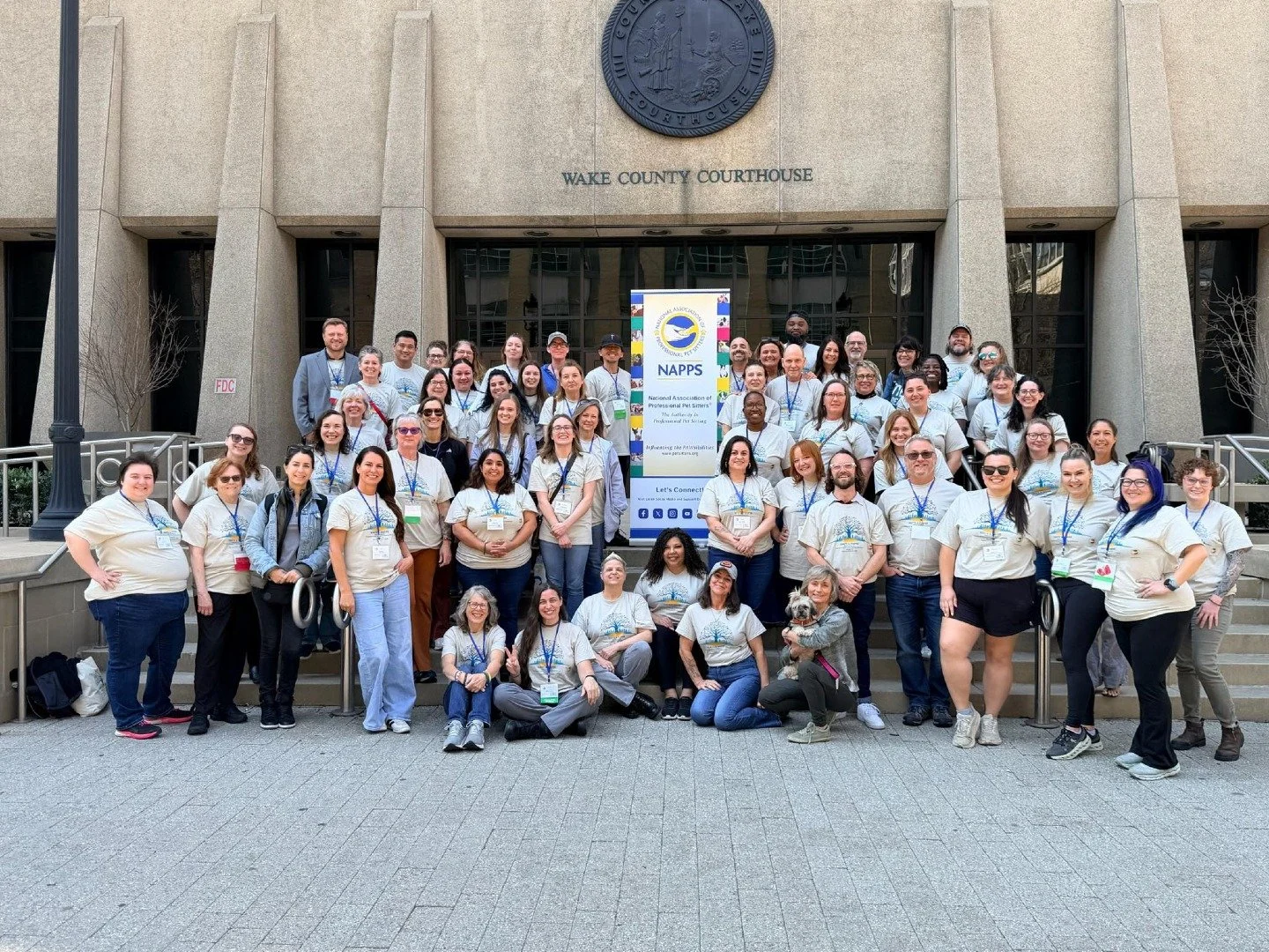 A group of pet sitters in front of wake county courthouse