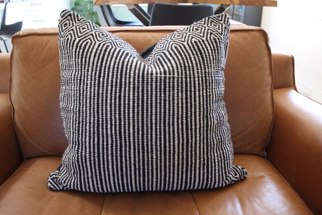 Tailored with love, this understated, textured cushion cover touts a minimalistic design. Crafted by talented North Indian artisans.