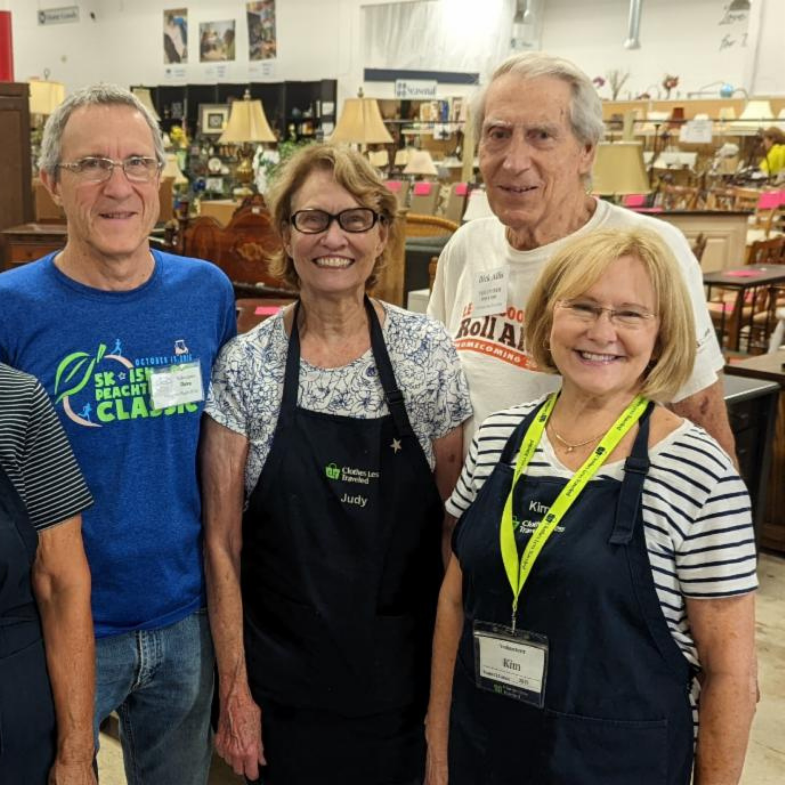 Volunteer Dick with Others at Clothes Less Traveled