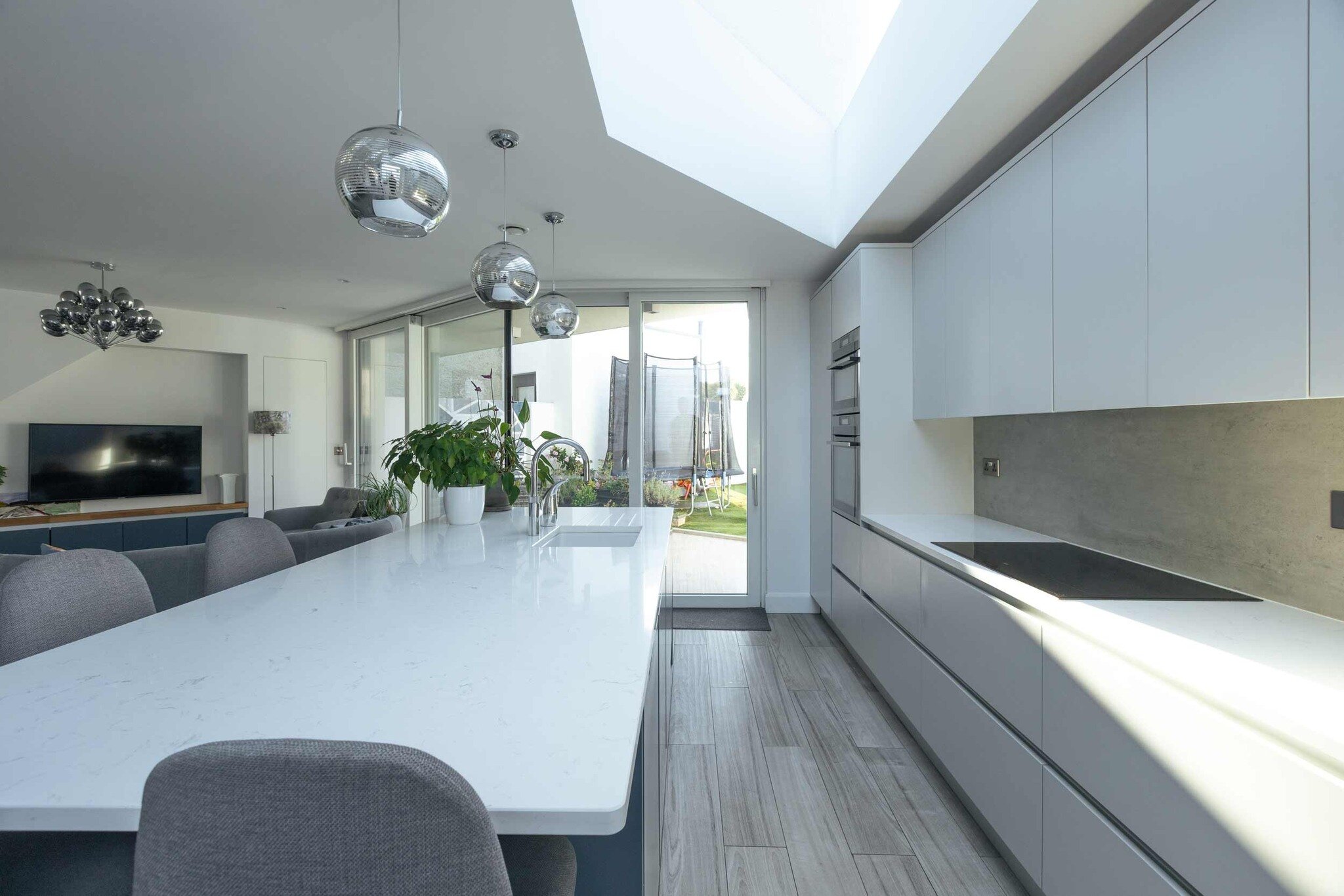 To create a brighter space for our client, we used a large skylight above the kitchen in this open-plan living area. 

The result? An abundance of natural light flooding the space, creating a brighter and more welcoming atmosphere ✨
.
.
.
#architect 