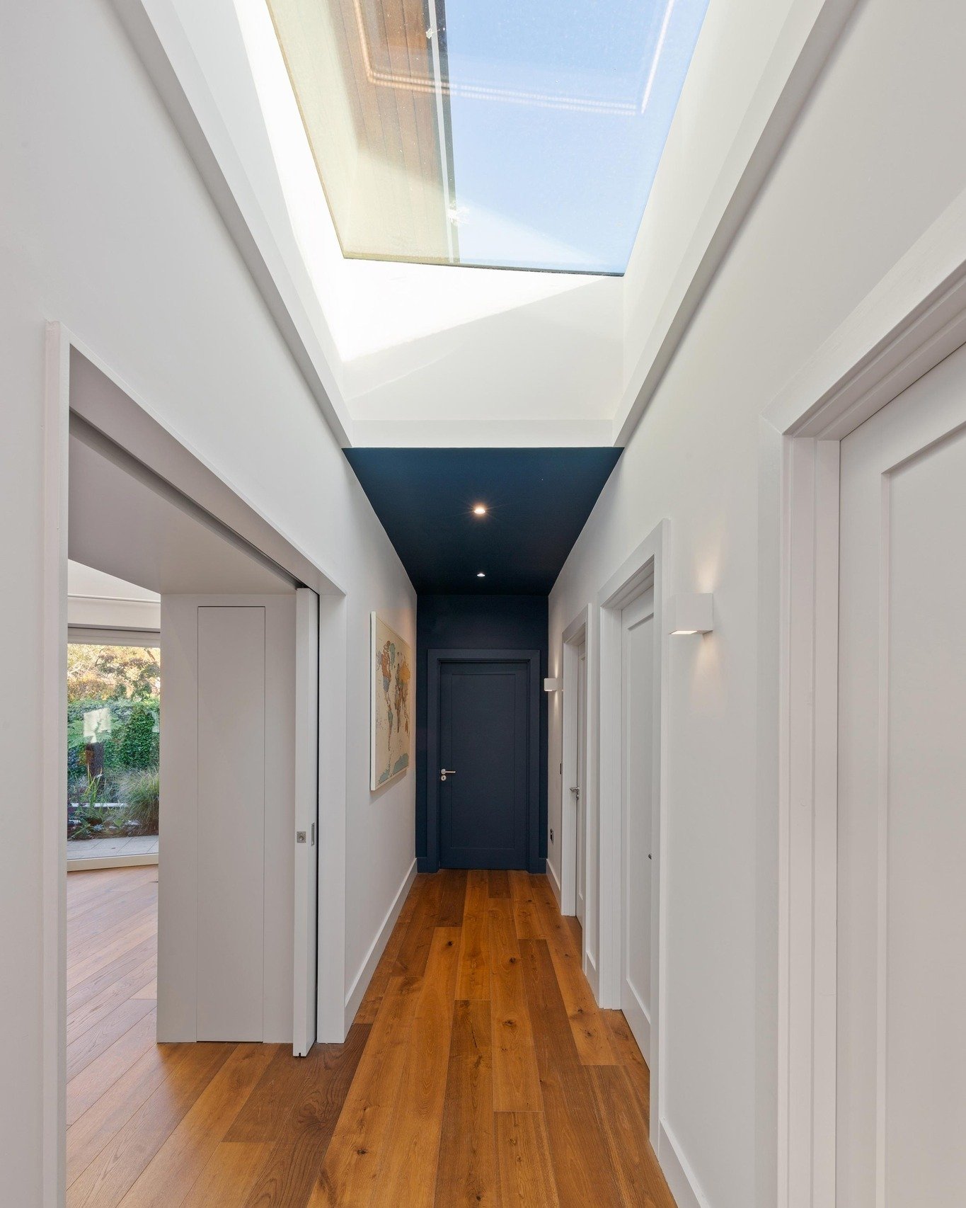This week we are sharing the interior of a previous client project of ours 🏡

Take a look at these hallway pictures &ndash; both angles highlight the huge skylight, flooding the space with sunlight, creating a bright and airy atmosphere ☀️

What do 