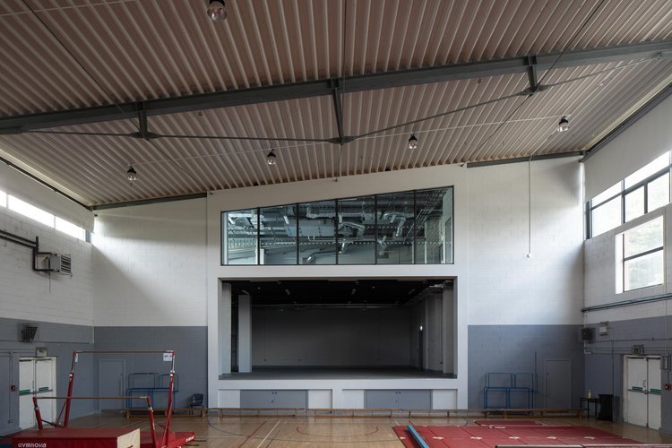 We had the opportunity to work on this sports and arts complex in Knocklyon.

What was previously a blank gable wall in the old sports hall is now an opening to the new extension designed by Bright Design Architects which houses a stage / back stage 