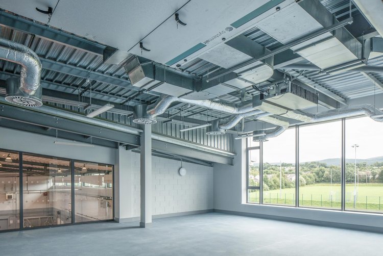 This state of the art new gym space in Knocklyon embraces the industrial design of the services and the structure which add character to the space, creating a modern and functional look that complements the multi-use nature of the building.

The huge