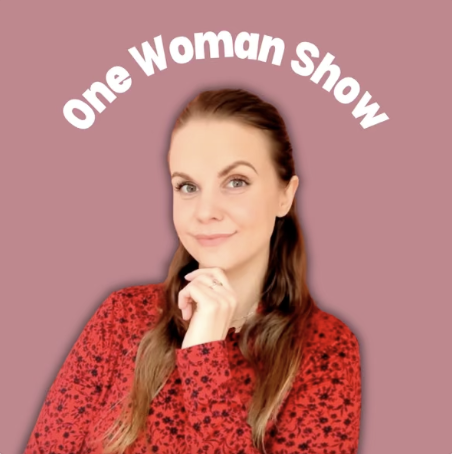 podcast cover, woman smiling wearing red on a pink background, title is one woman show