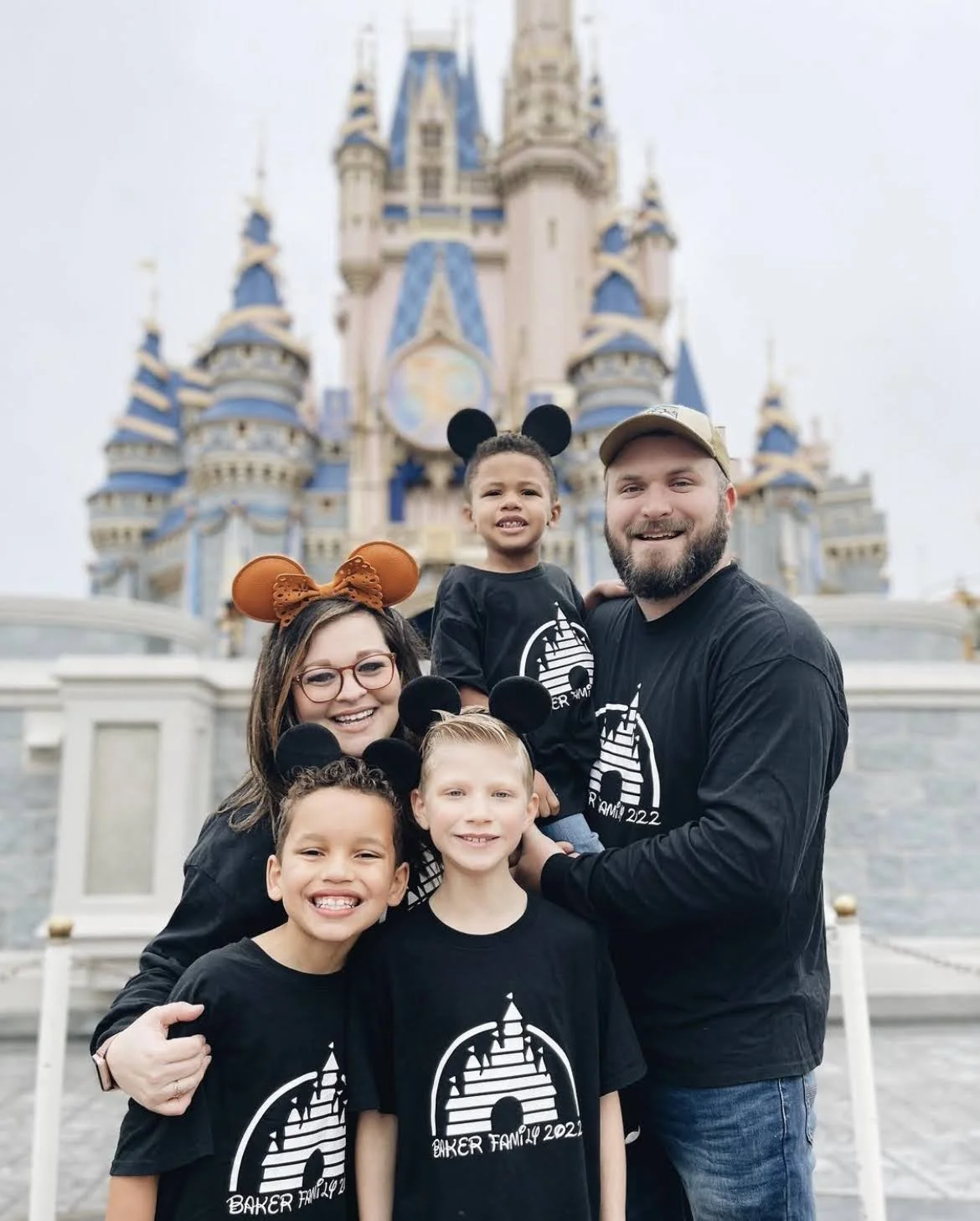 A happy family in front of Cinderella Castle