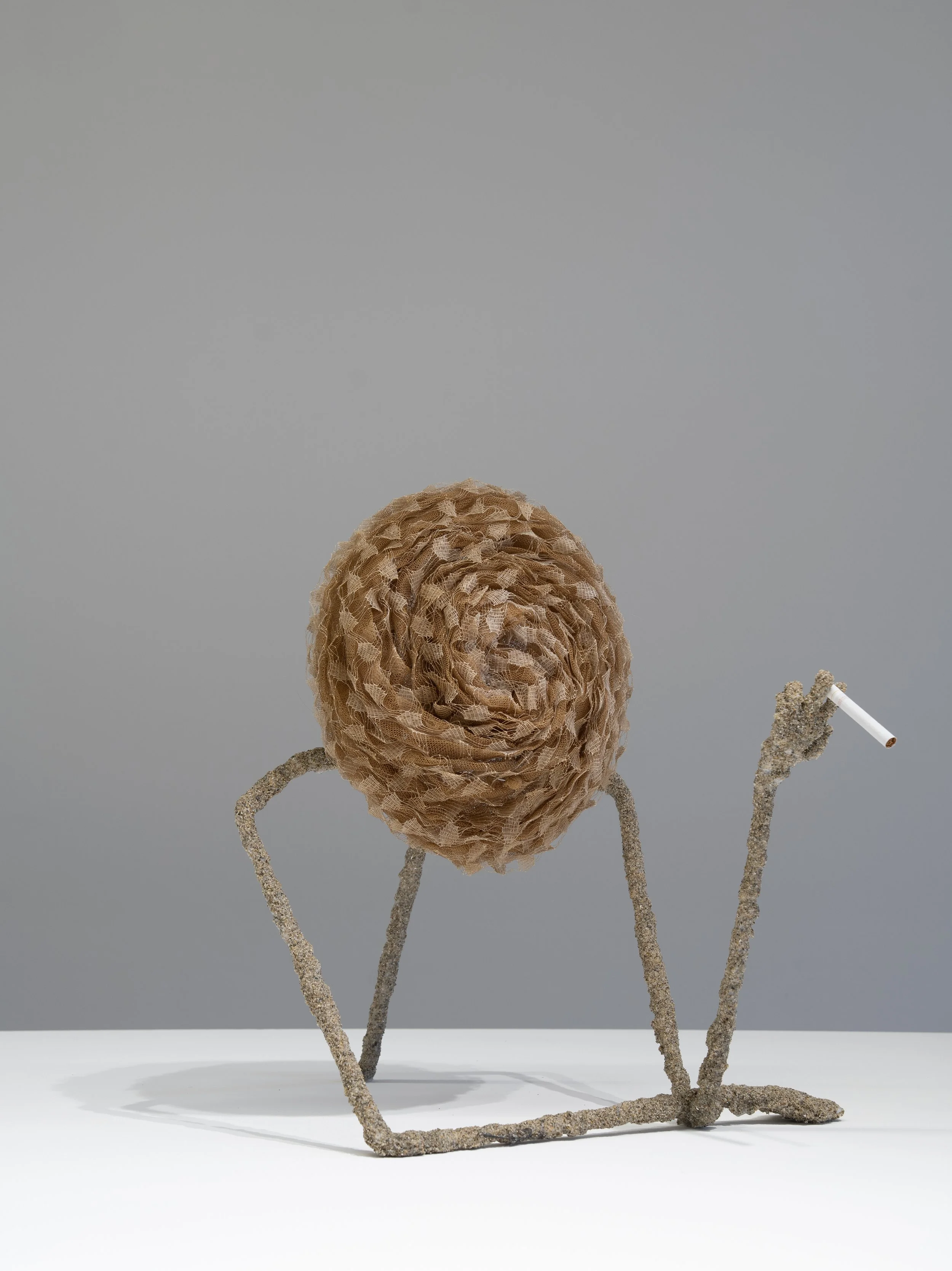 Rasmus Myrup
Chapeau Chéri·e·x (Sable), 2025
Sand from Lake Neuchâtel, steel, padding foam, cigarette and Aliette Bordeaux hat in synthetic tulle