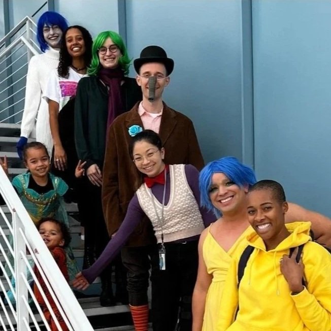 The Marlin Lab in Halloween costumes on the stairs.