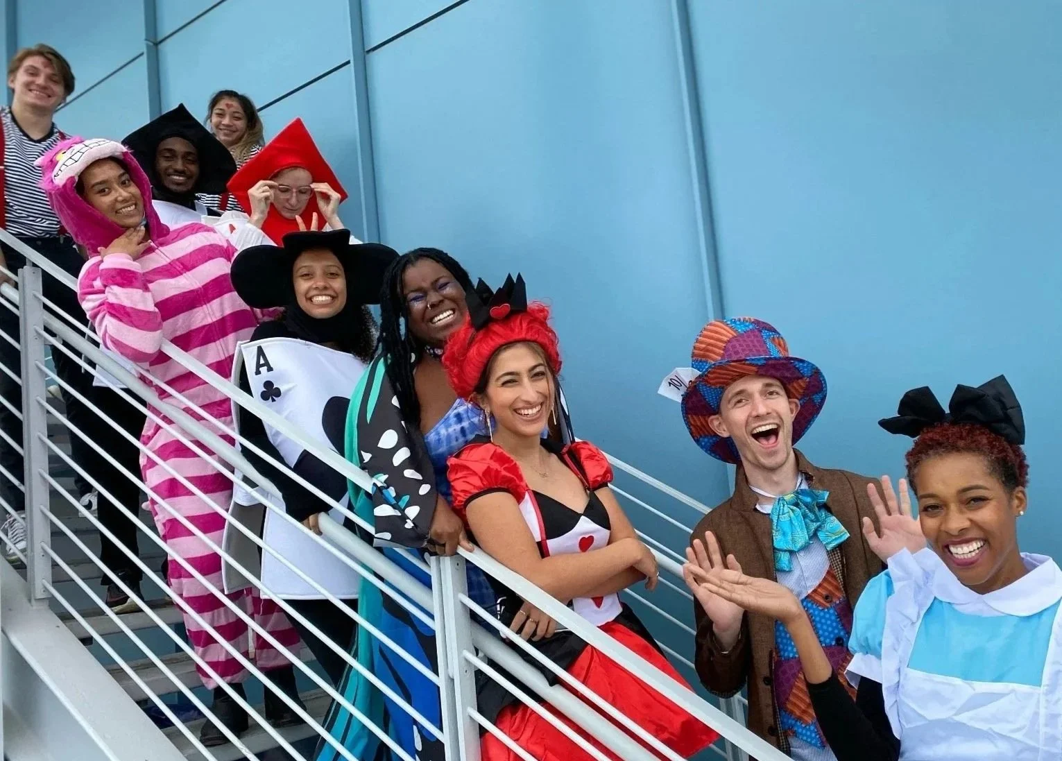 The Marlin Lab in Halloween costumes on a large staircase.