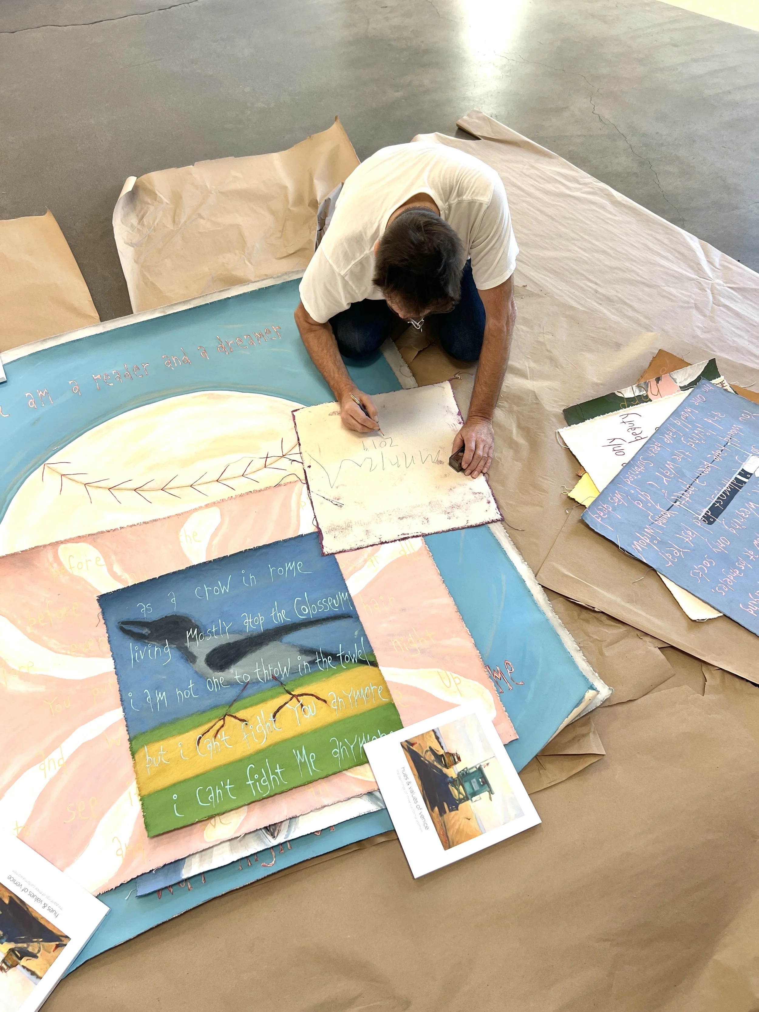 Michael Deyermond signing his work for a collector, 2025