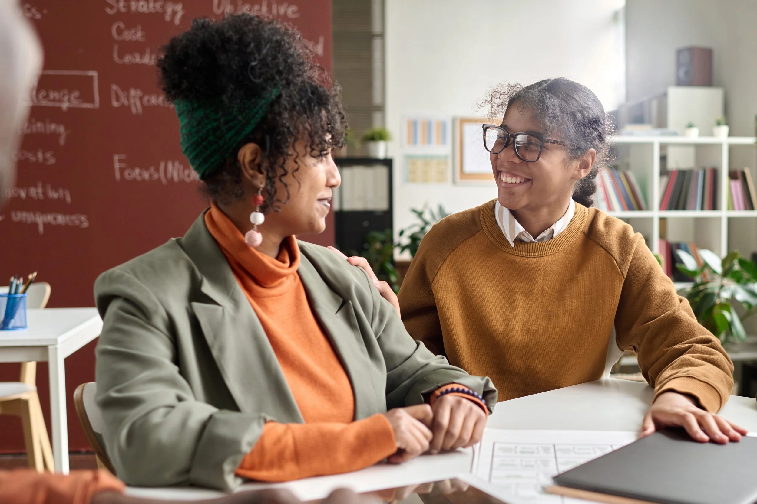 A mentor has a warm conversation with her mentee