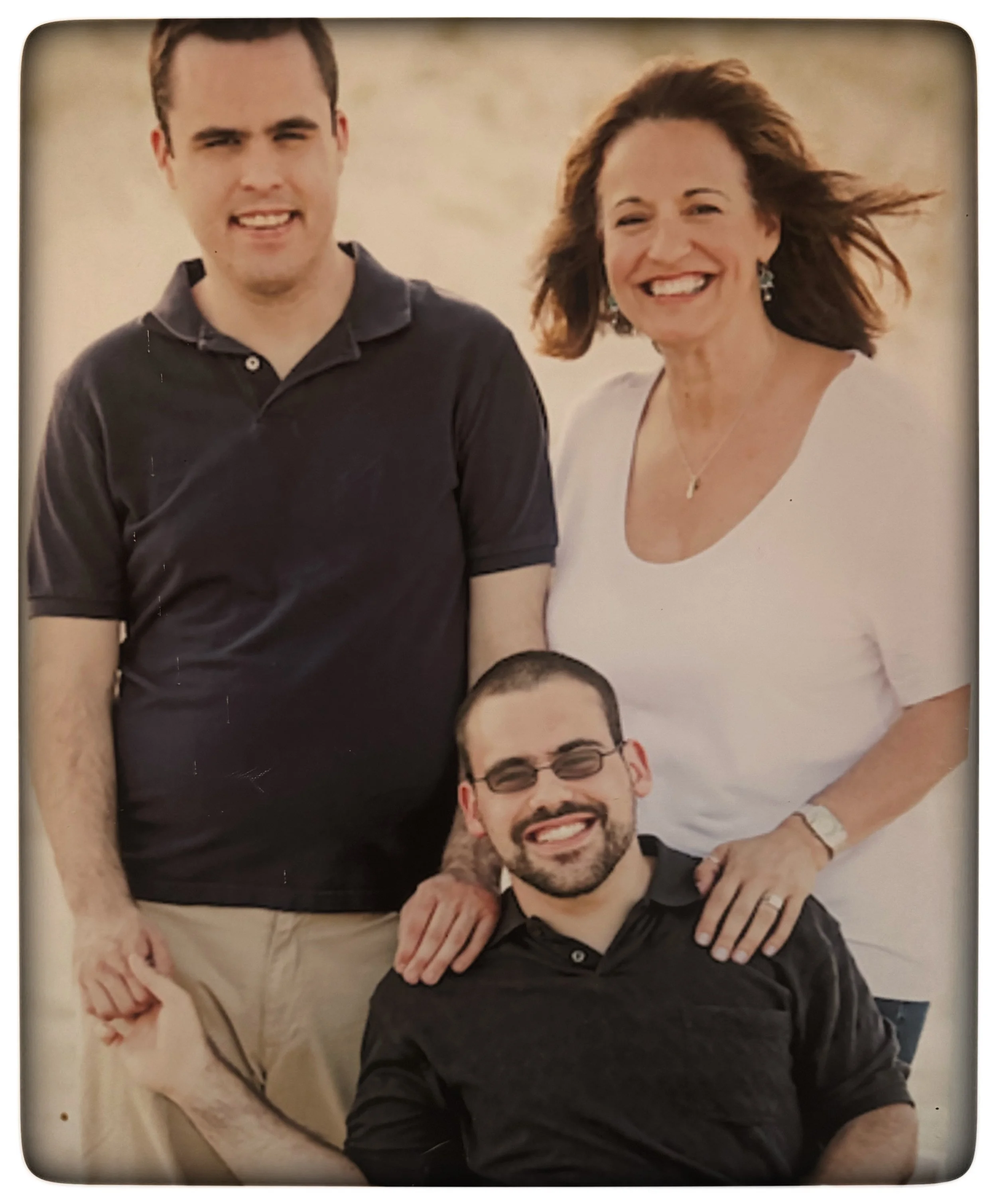 Debbie with her boys as grown men
