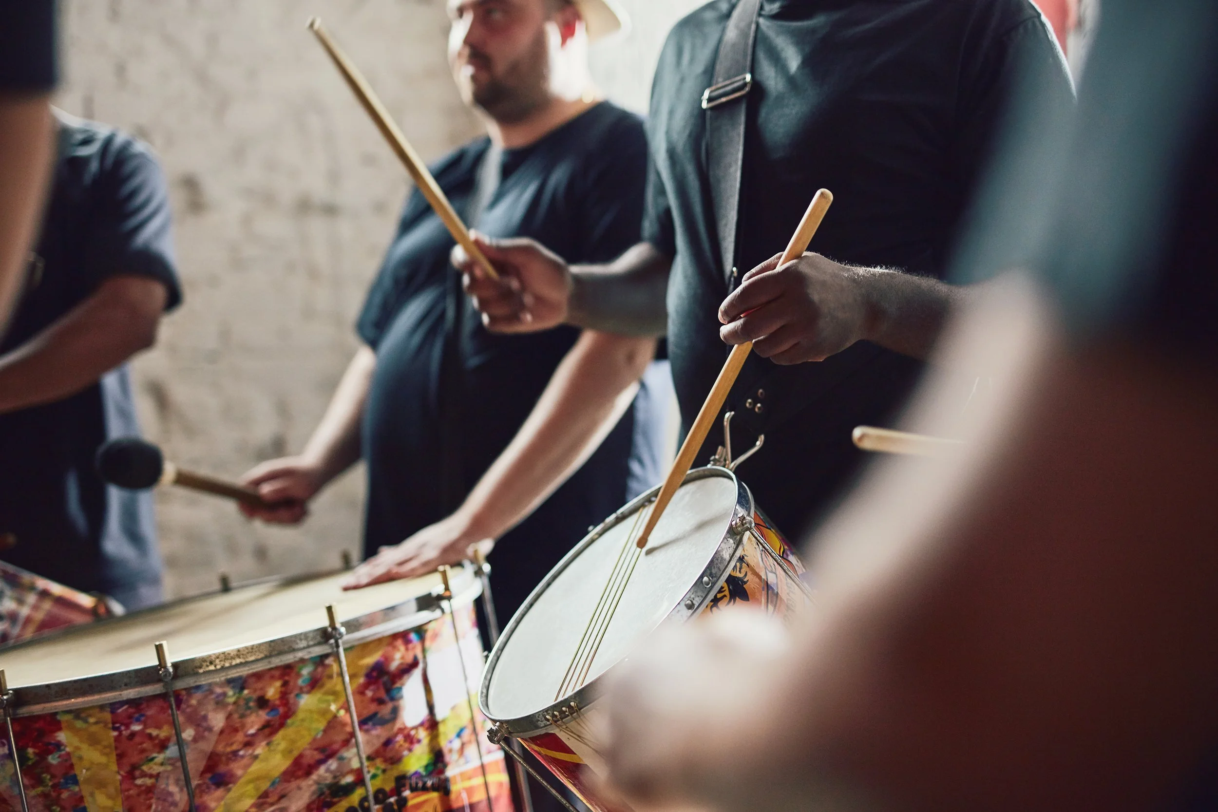 Drummers Playing Percussion Instruments Indoors