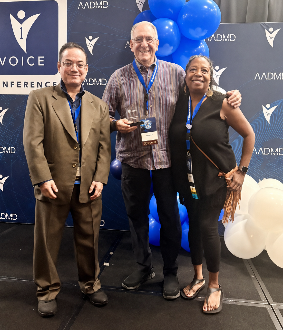 Neil Romano receiving his award