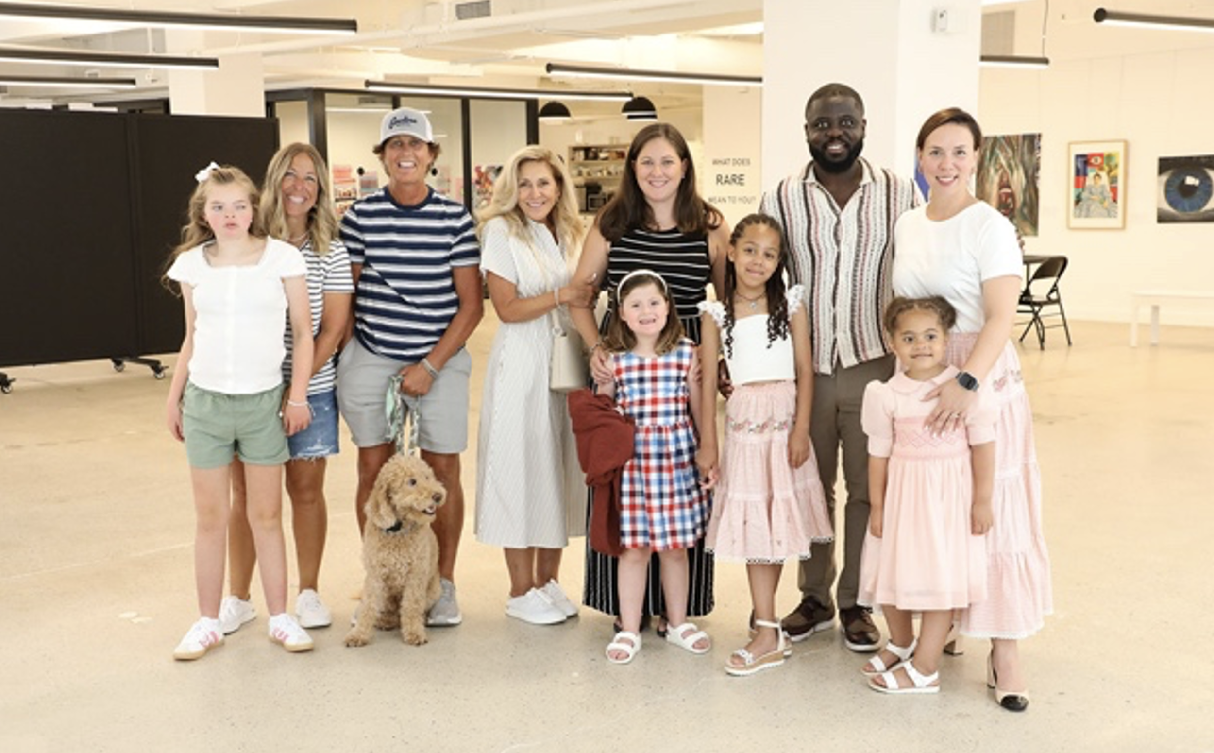 A group photo of Sophia, Olivia, their parents and others