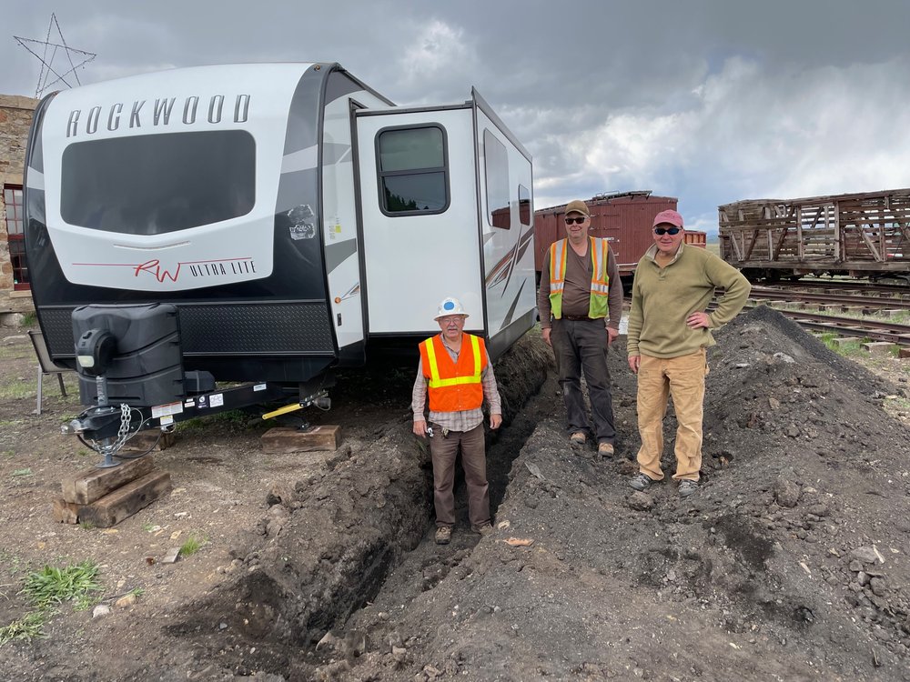  To provide an opportunity for Chuck Brantigan to be able to enjoy his “dream” comfortably of the development of the Como Railroad Heritage Campus Joey Knous, Chris and Bob Revis installed a septic system for the Brantigan house trailer 