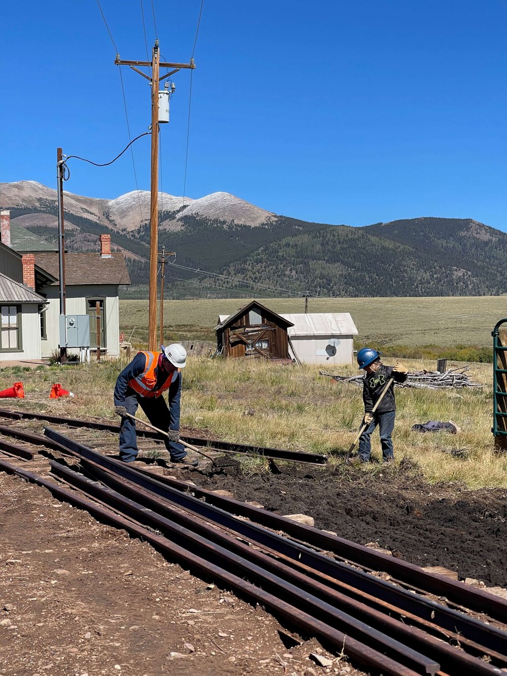  Volunteers Jim and Takoda continue work on the track between the depot and roundhouse.  