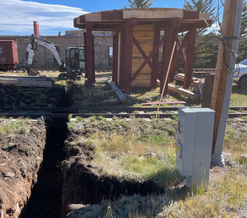  With a new drop service / pedestal service box installed by CORE Electric last spring, Operator Chris Tome trenched from service pole to Roundhouse to install new service feed to enable upgrading electric service in Roundhouse. &nbsp;    Not in phot