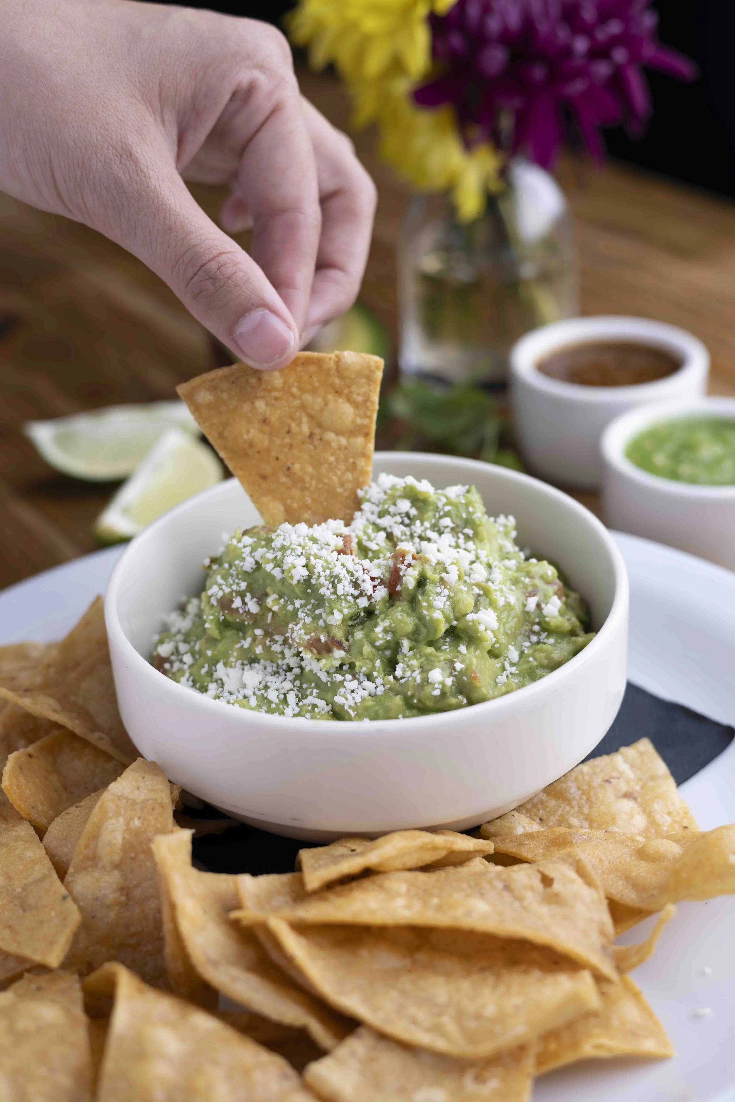 Photo by Chris Thurman, guacamole and chips being dipped