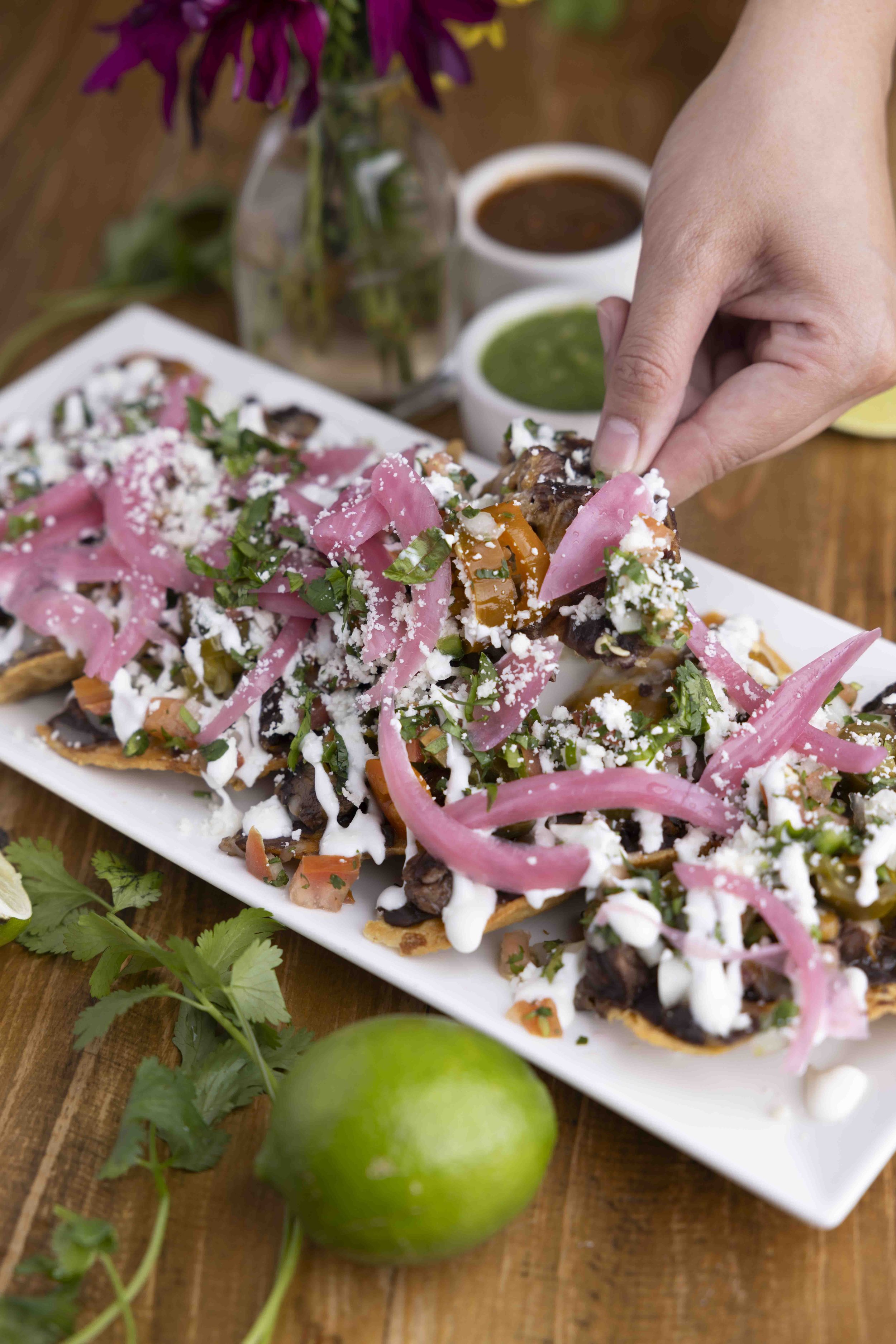 Photo by Chris Thurman, loaded nachos with cheese, cilantro, beans and more