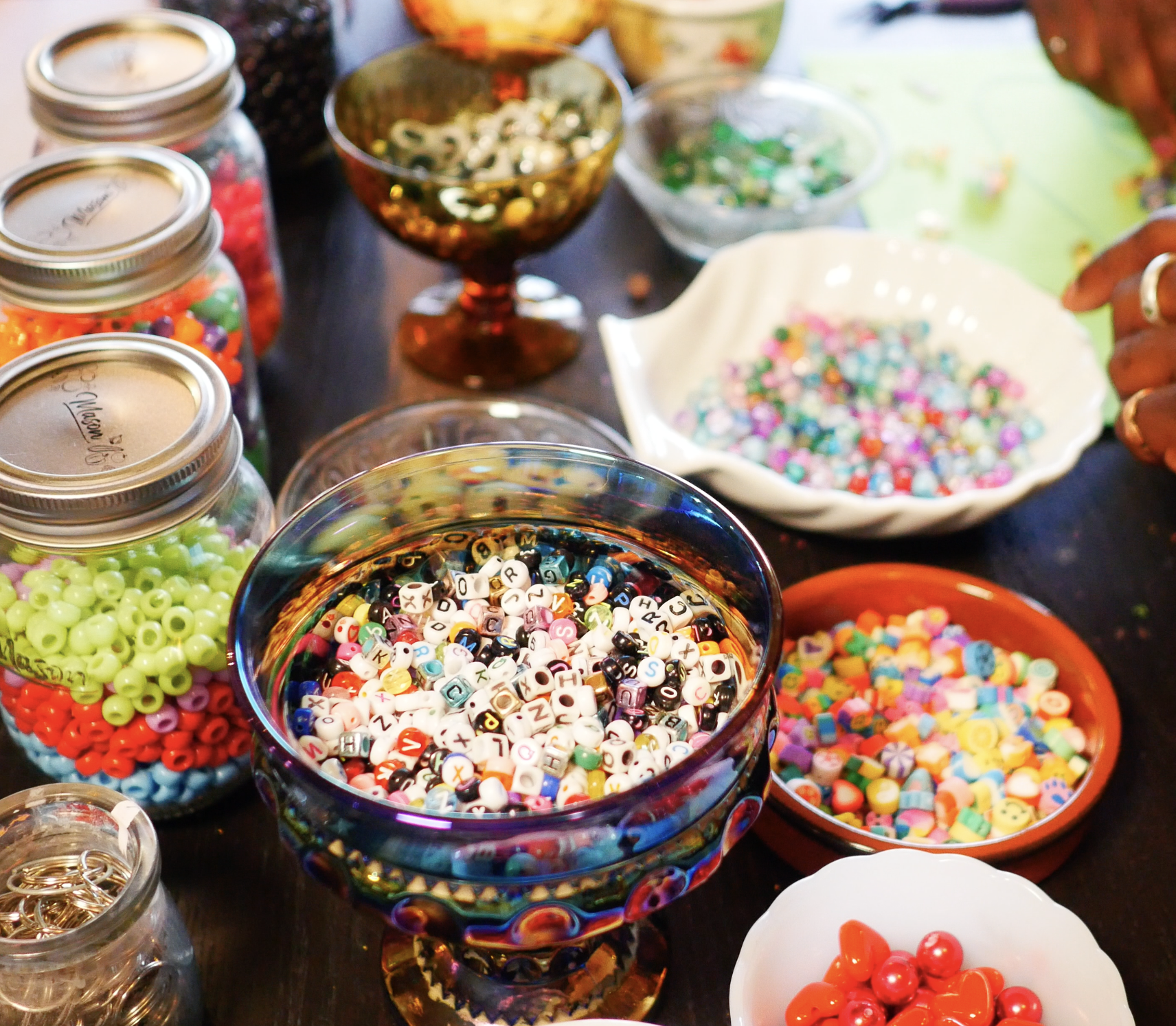 An overhead shot of an array of beads and charms