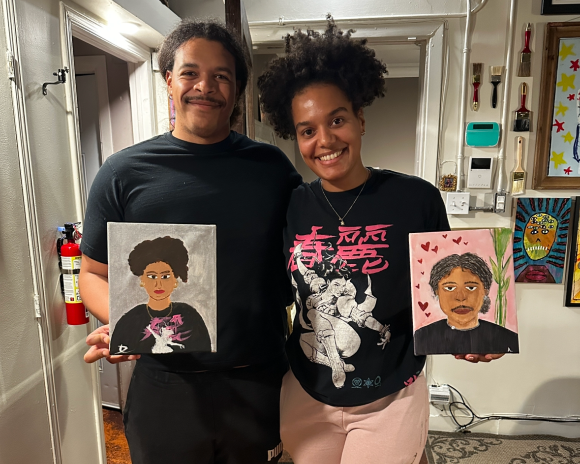 Couple proudly displays their date night paintings