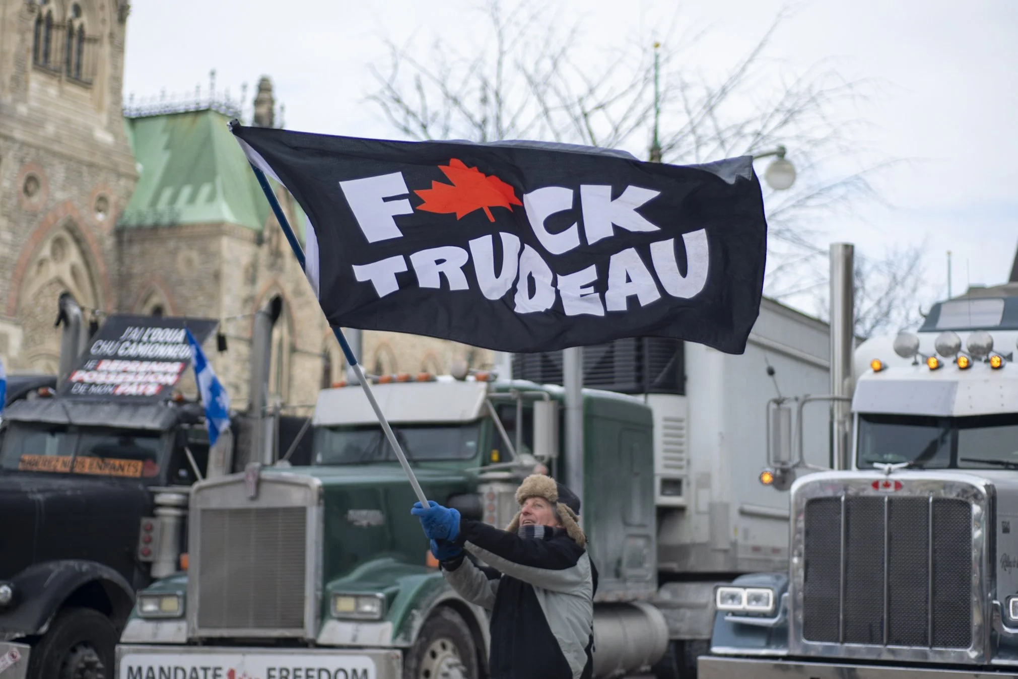 Protester flying large "Fuck Trudeau" flag at the Ottawa Convoy - January 31, 2021