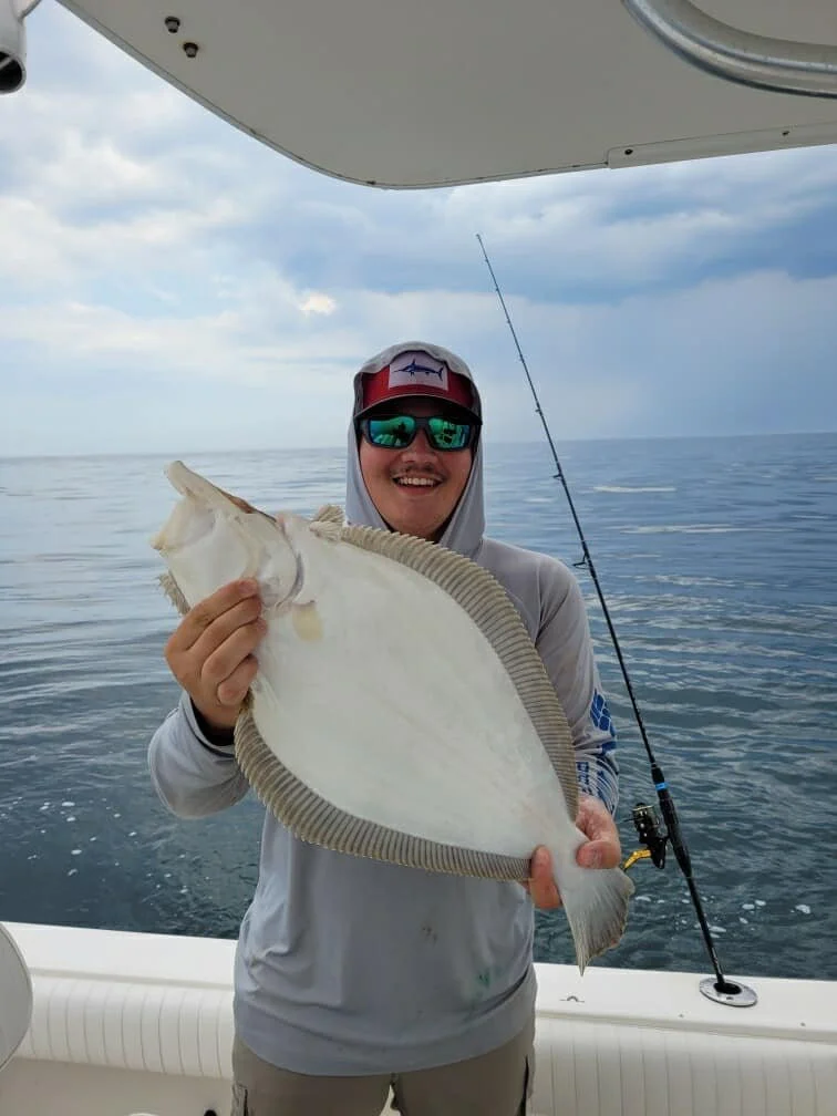 guy-with-flounder.jpeg