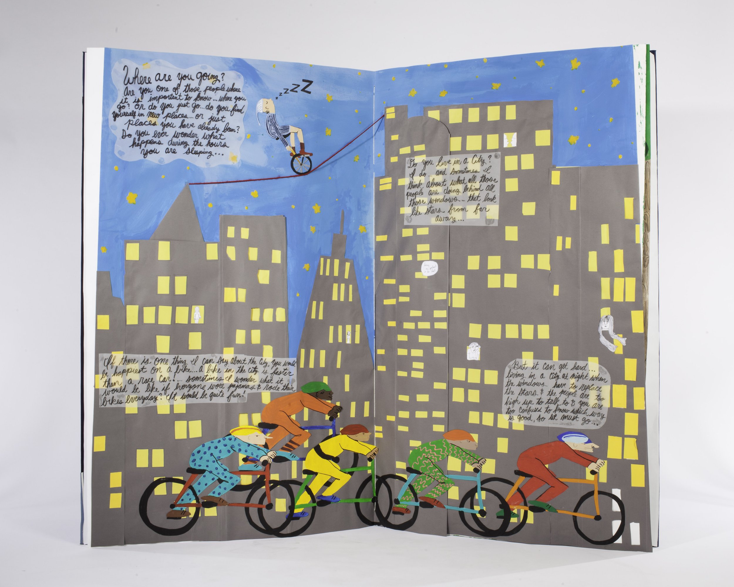construction paper collage of bikers in a city and blurbs of poetry about the city and life