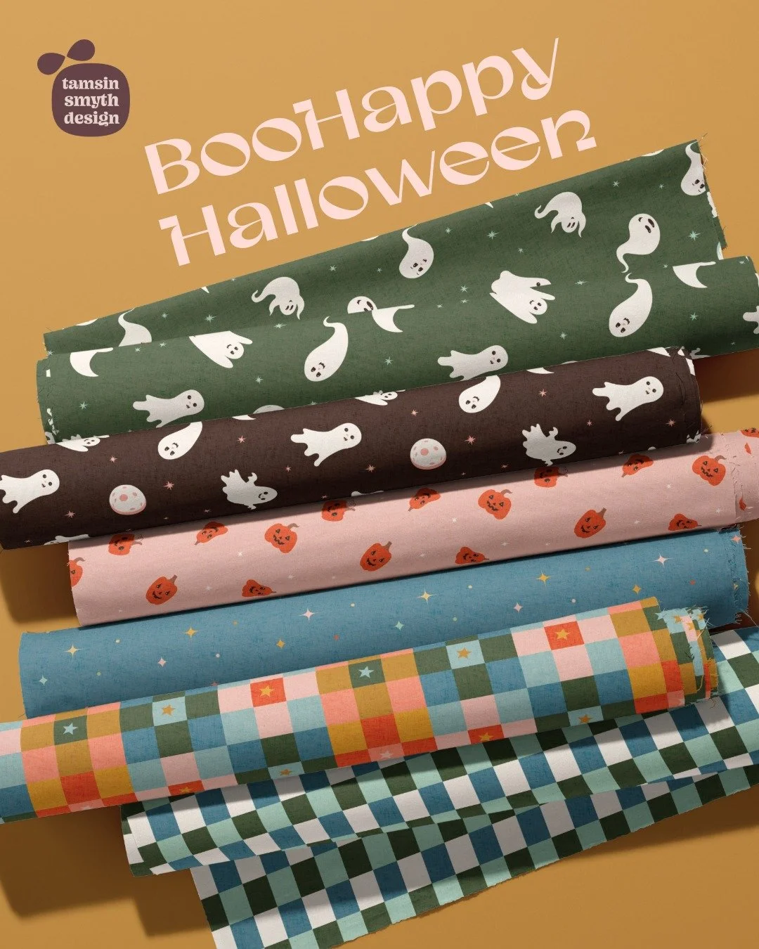 A group of fabric bolts featuring a fabric collection called Boohappy Halloween by Tamsin Smyth.
