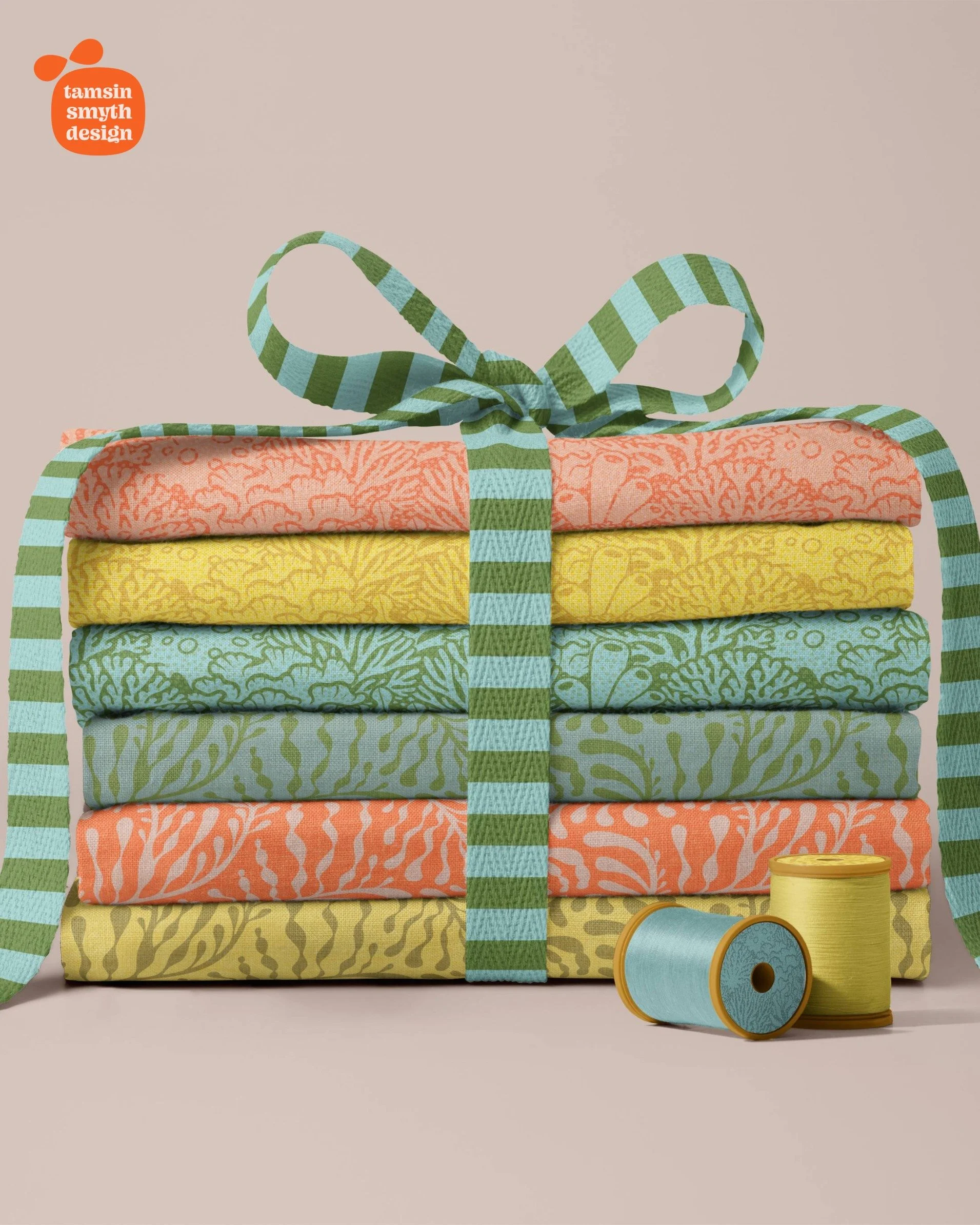 A stack of 6 fabrics with tropical coral reef designs in warm tones