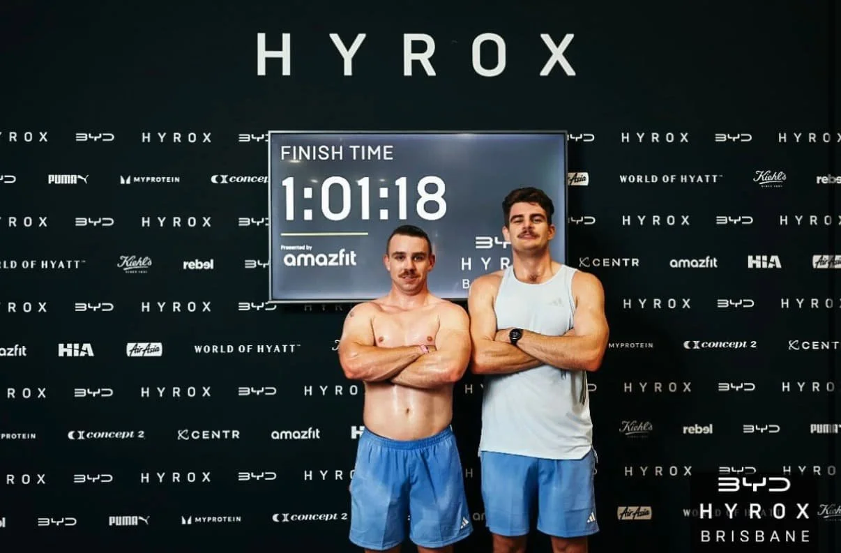 Two members of The Bar Health and Fitness - performing exercises in a Hybrid group class