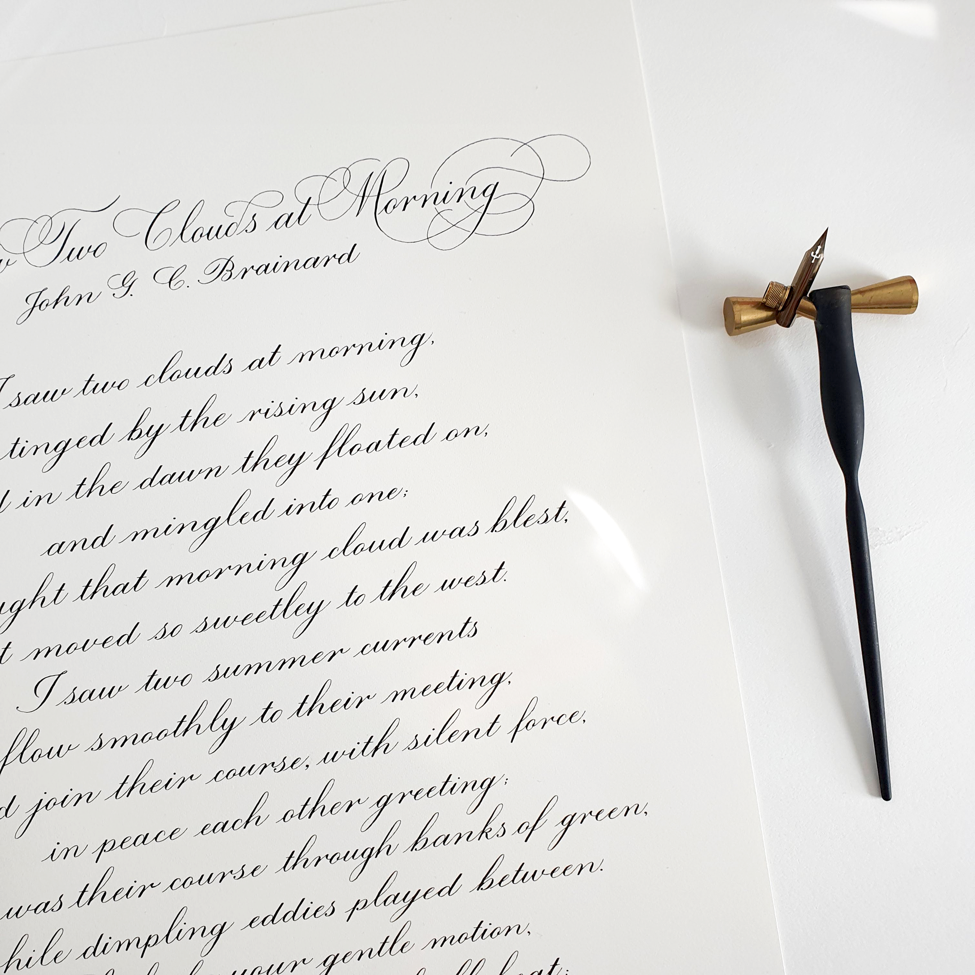 Poem written on A3 paper in calligraphy with black ink. The title of the poem has additional flourishes.