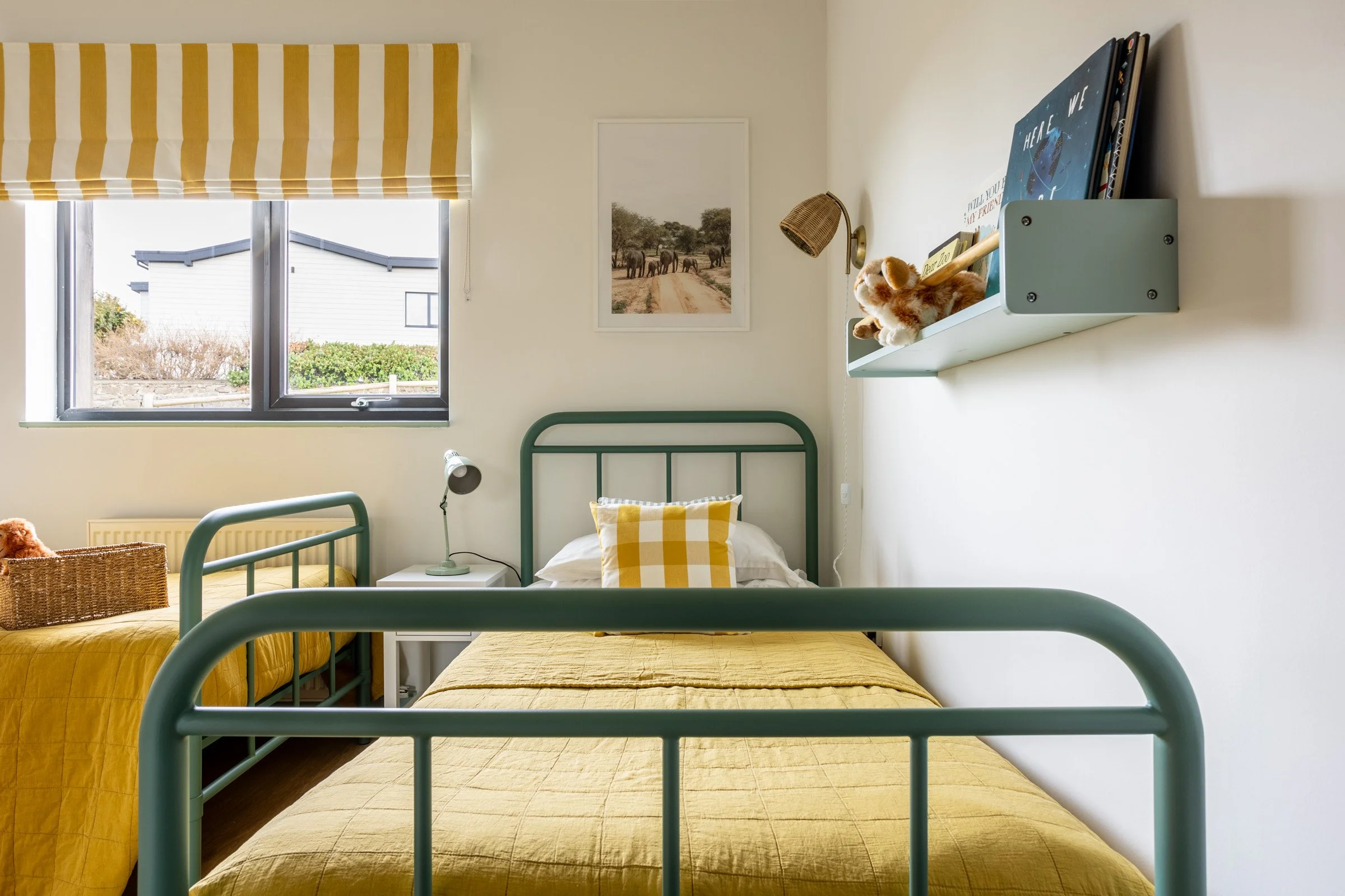 Holiday let in Rhosneigr, North Wales with beach hut design, twin bedroom and family-friendly coastal interiors.